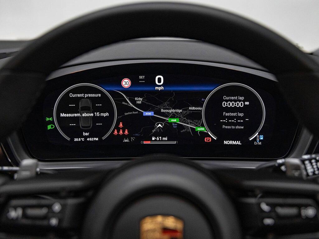 An interior shot of the driver instruments on a 2023 Porsche CAYENNE