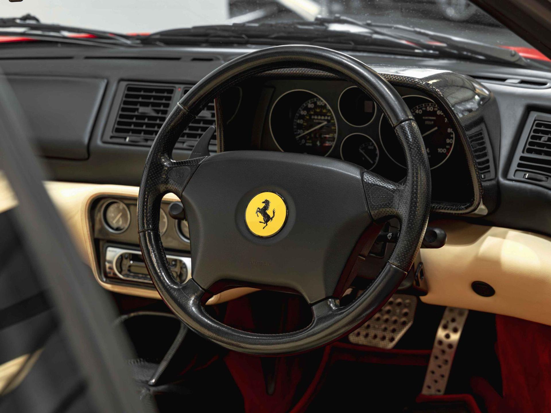 An interior shot of the steering wheel on a 1997 Ferrari F355