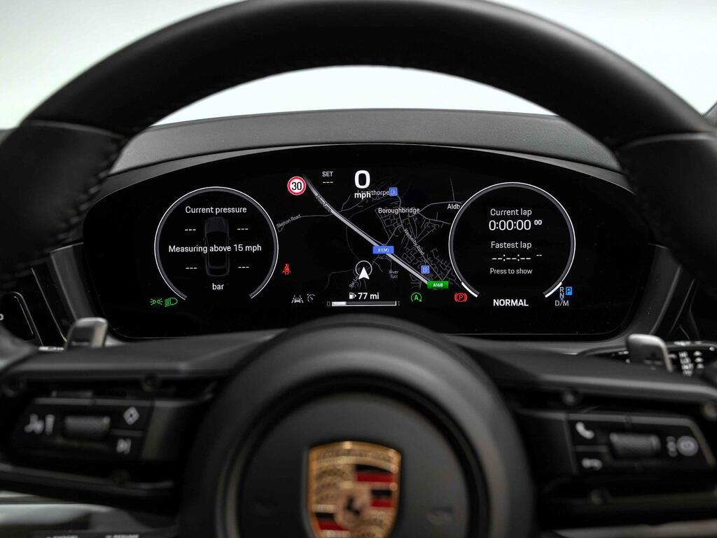 An interior shot of the driver instruments on a 2023 Porsche Cayenne
