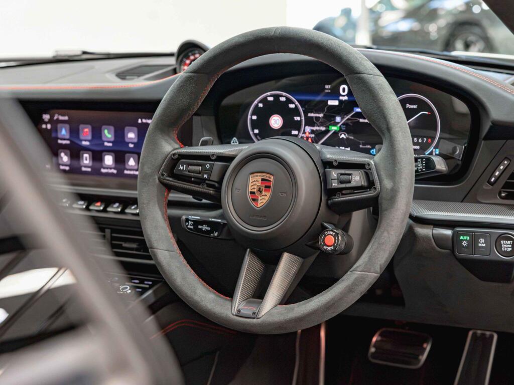 An interior shot of the steering wheel on a 2026 Porsche 911