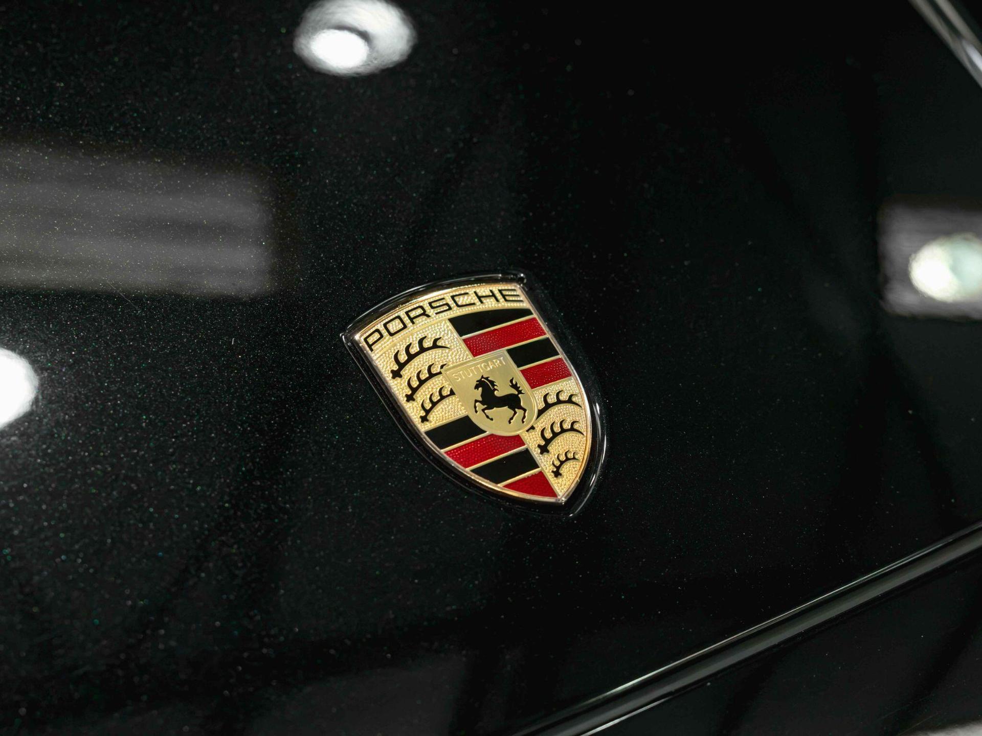 An exterior shot of the badge exterior on a 2024 Porsche Cayenne