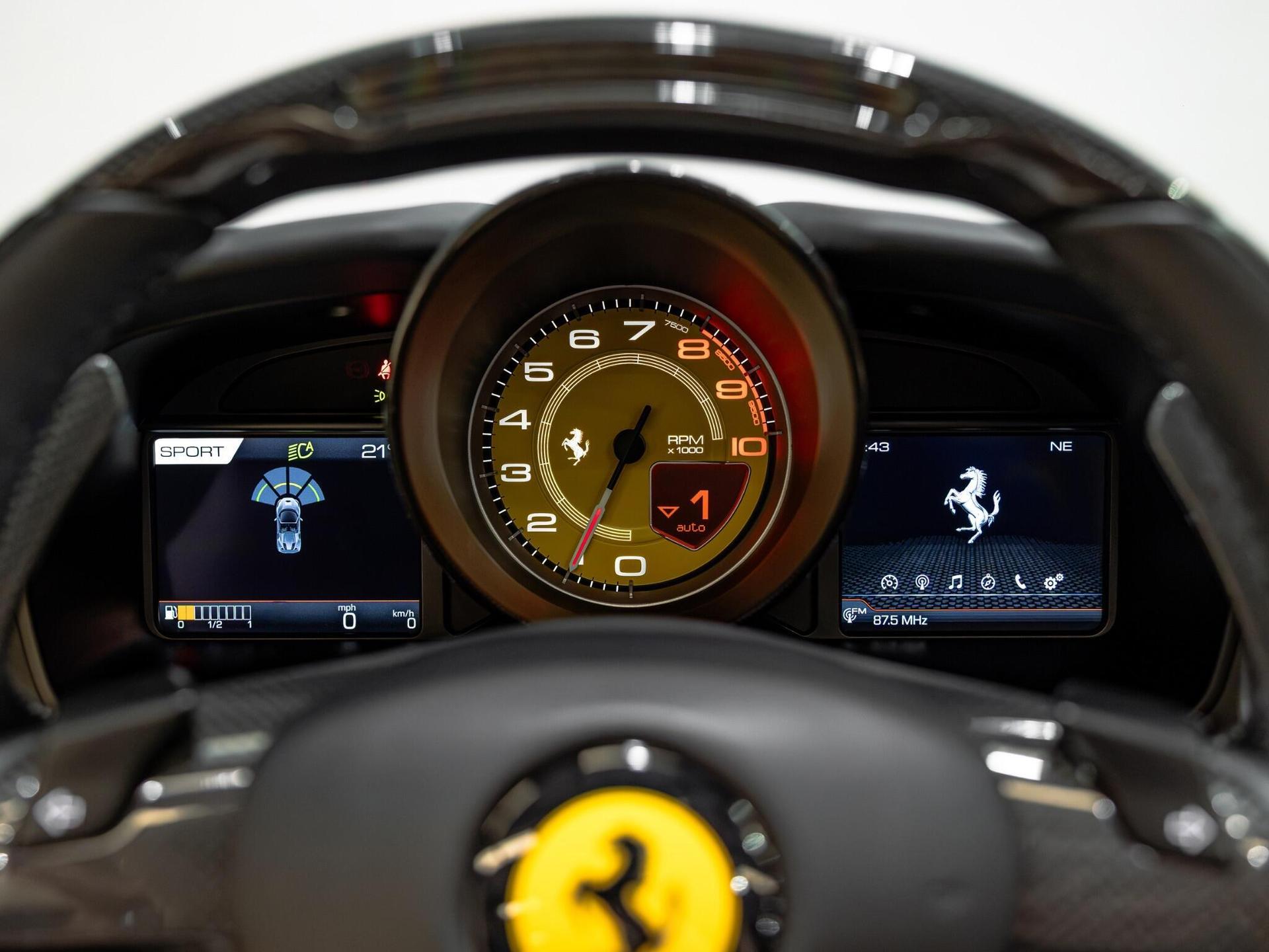An interior shot of the driver instruments on a 2021 Ferrari F8 Spider