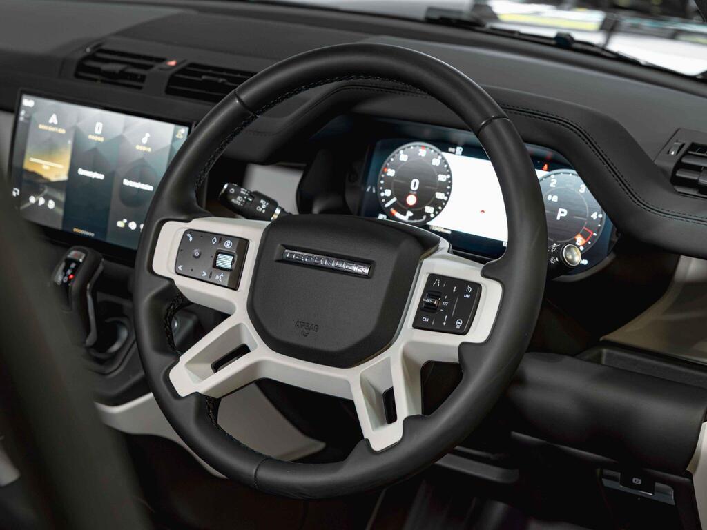 An interior shot of the steering wheel on a 2024 Land Rover Defender 110