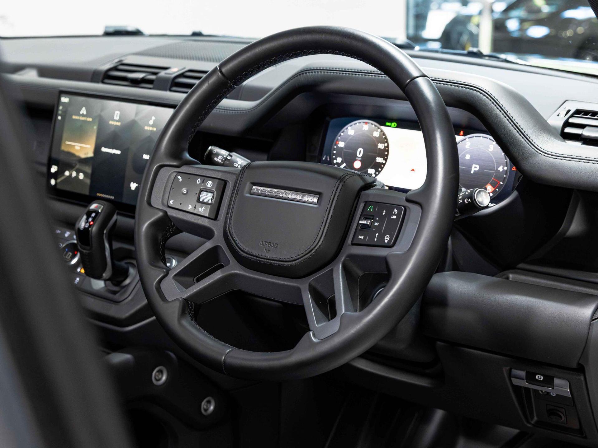 An interior shot of the steering wheel on a 2023 Land Rover Defender 110