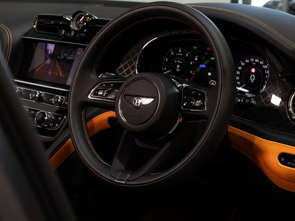 An interior shot of the steering wheel on a 2025 Bentley Bentayga