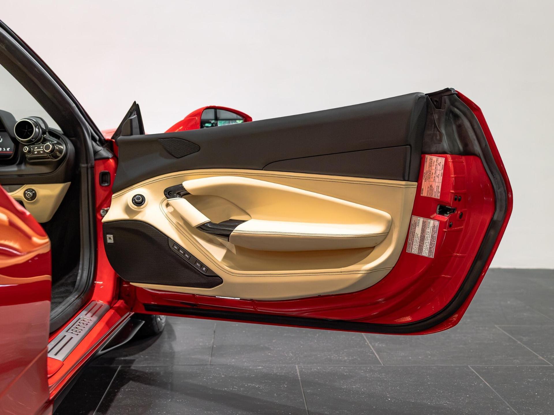 An interior shot of the door interior on a 2021 Ferrari F8 Spider