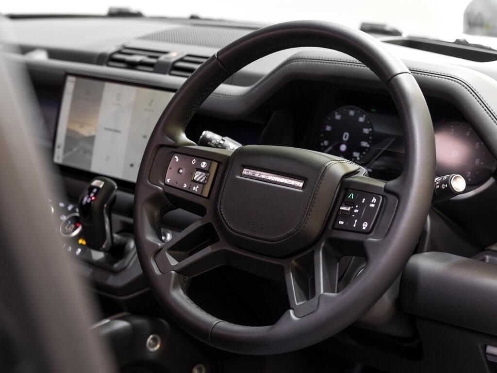 An interior shot of the steering wheel on a 2025 Land Rover Defender 110