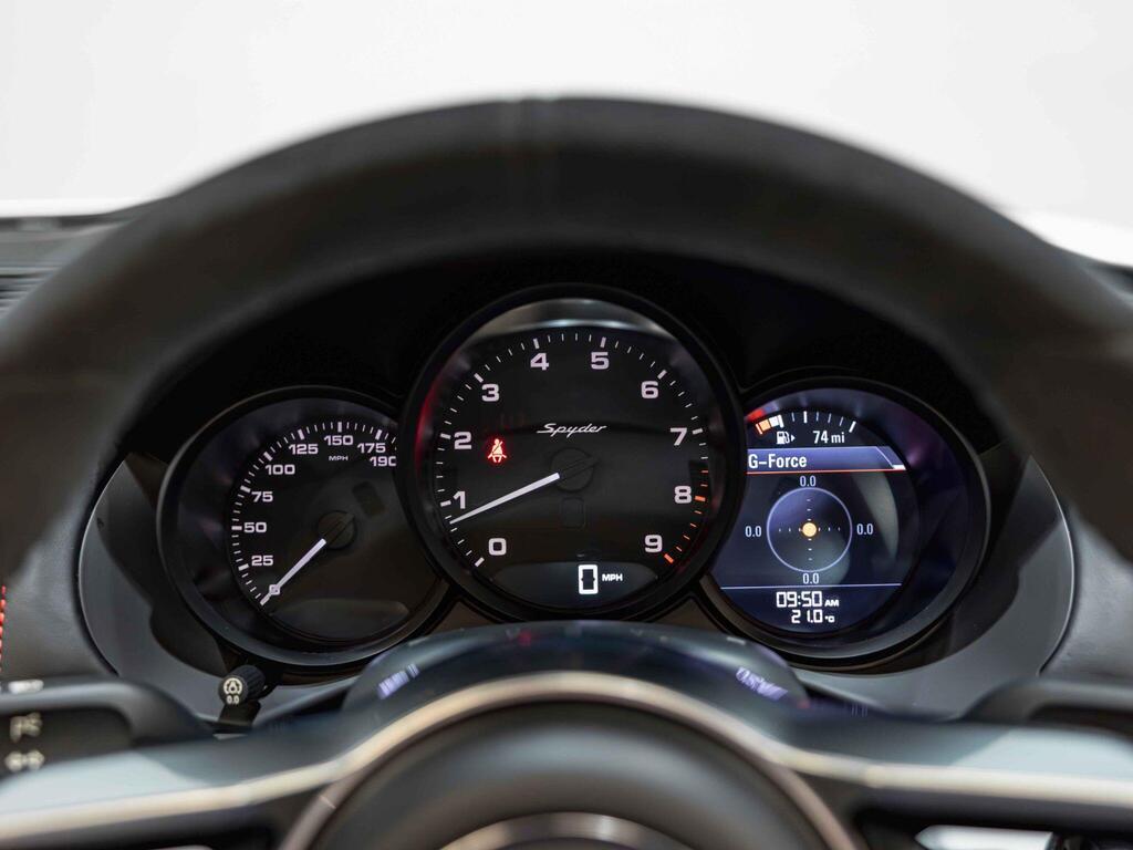 An interior shot of the driver instruments on a 2015 Porsche Boxster