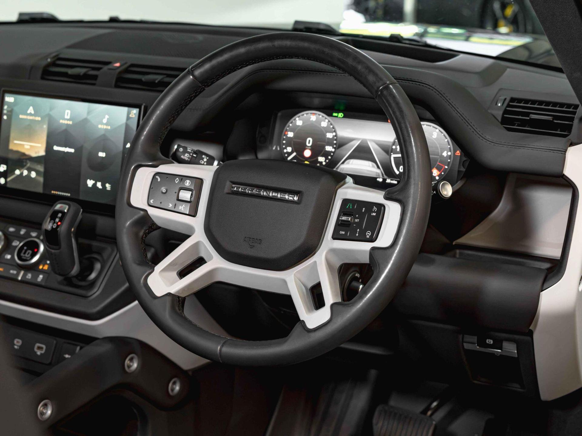 An interior shot of the steering wheel on a 2024 Land Rover Defender 90