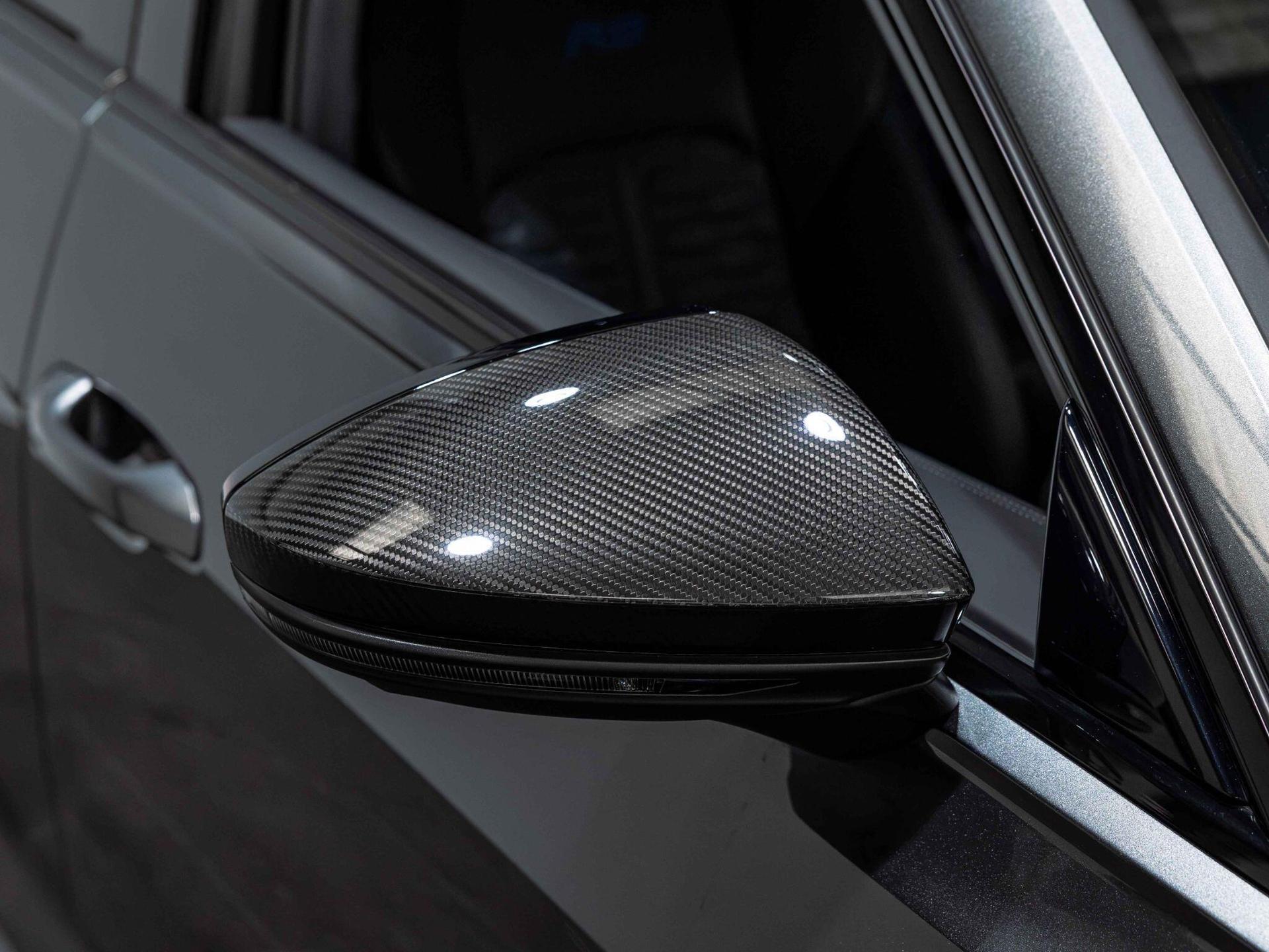 An exterior shot of the wing mirror on a 2024 Audi RS6 Avant