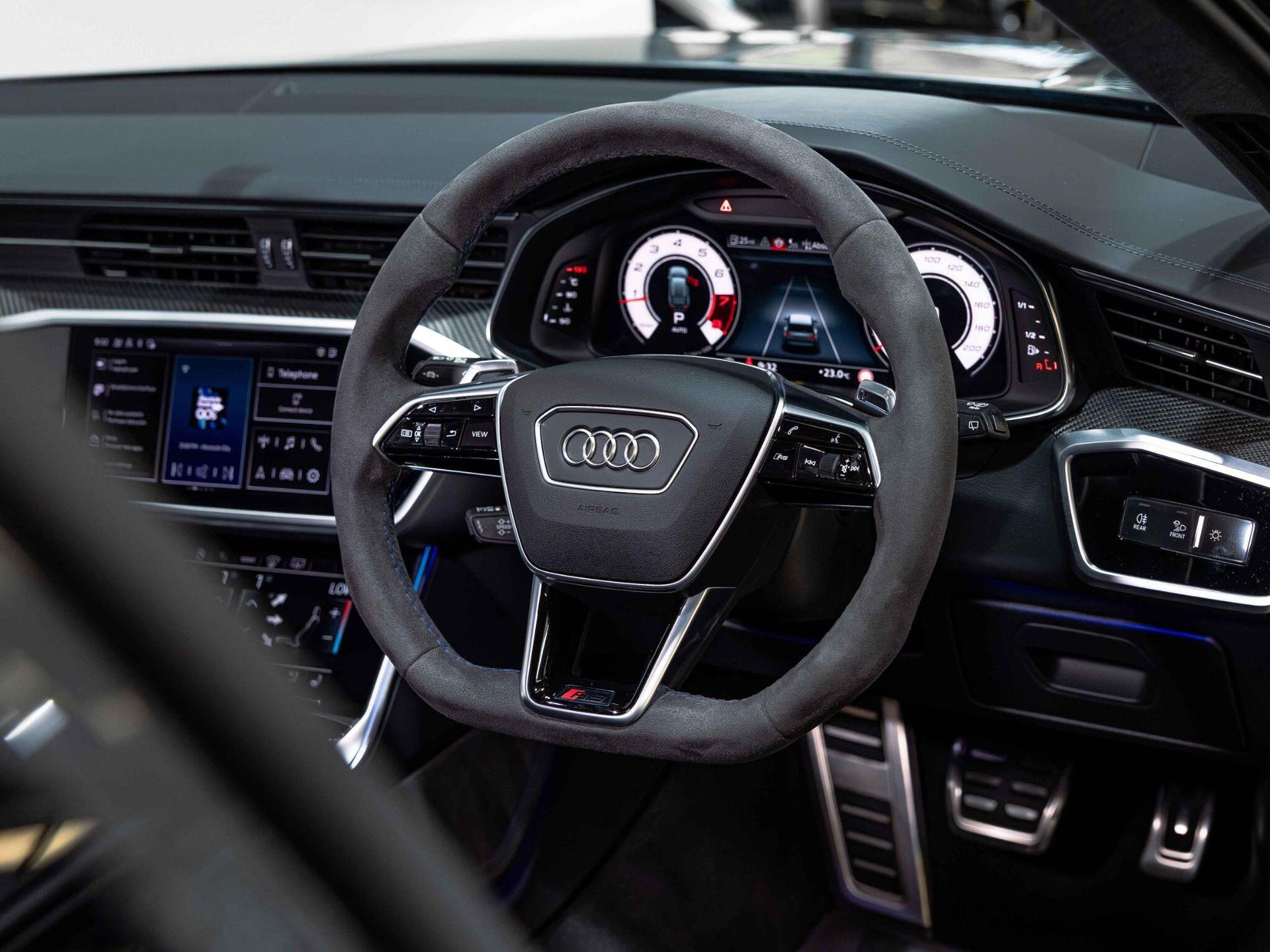 An interior shot of the steering wheel on a 2024 Audi RS6 Avant