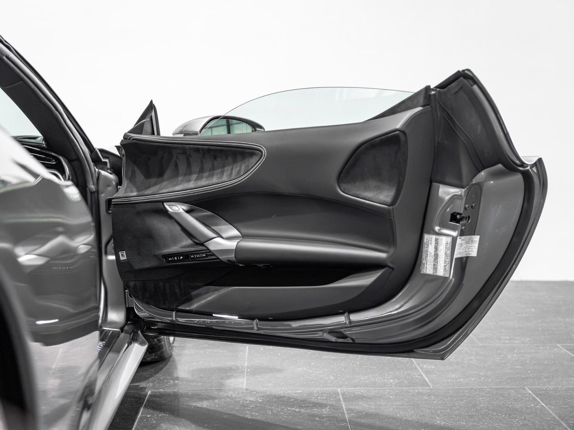 An interior shot of the door interior on a 2023 Ferrari SF90 Spider