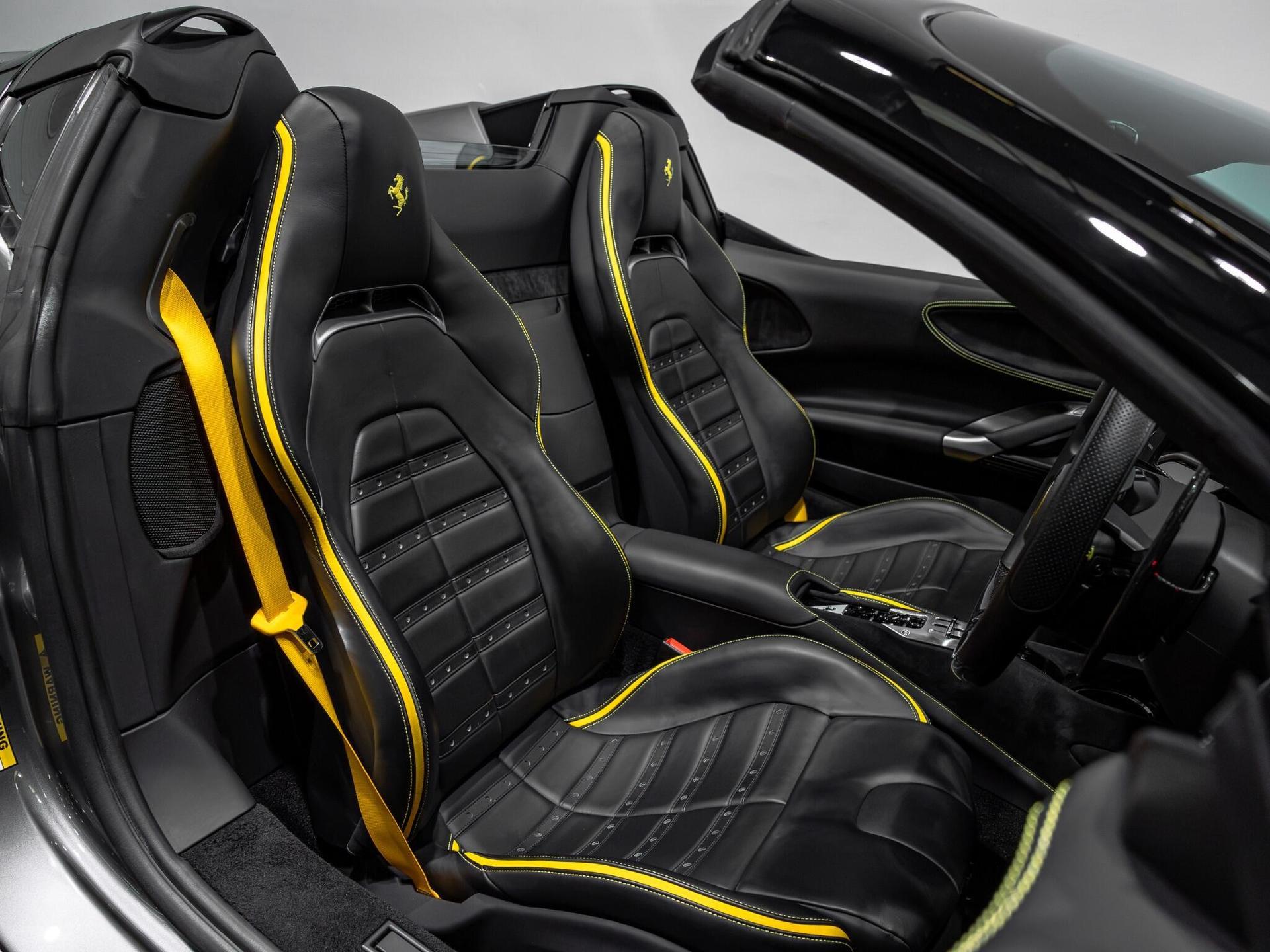 An interior shot of the driver seat on a 2023 Ferrari SF90 Spider