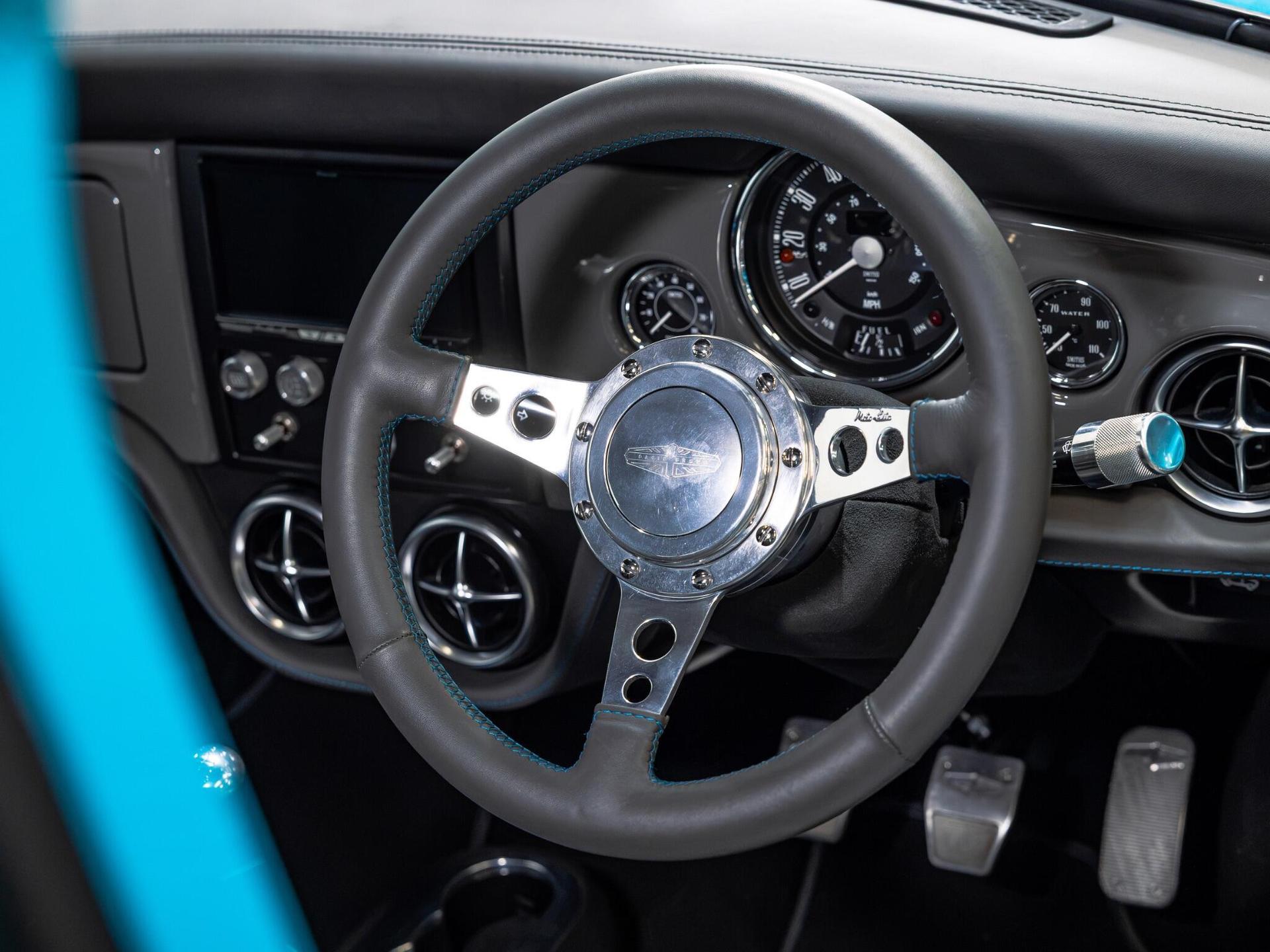 An interior shot of the steering wheel on a 1997 Rover Mini