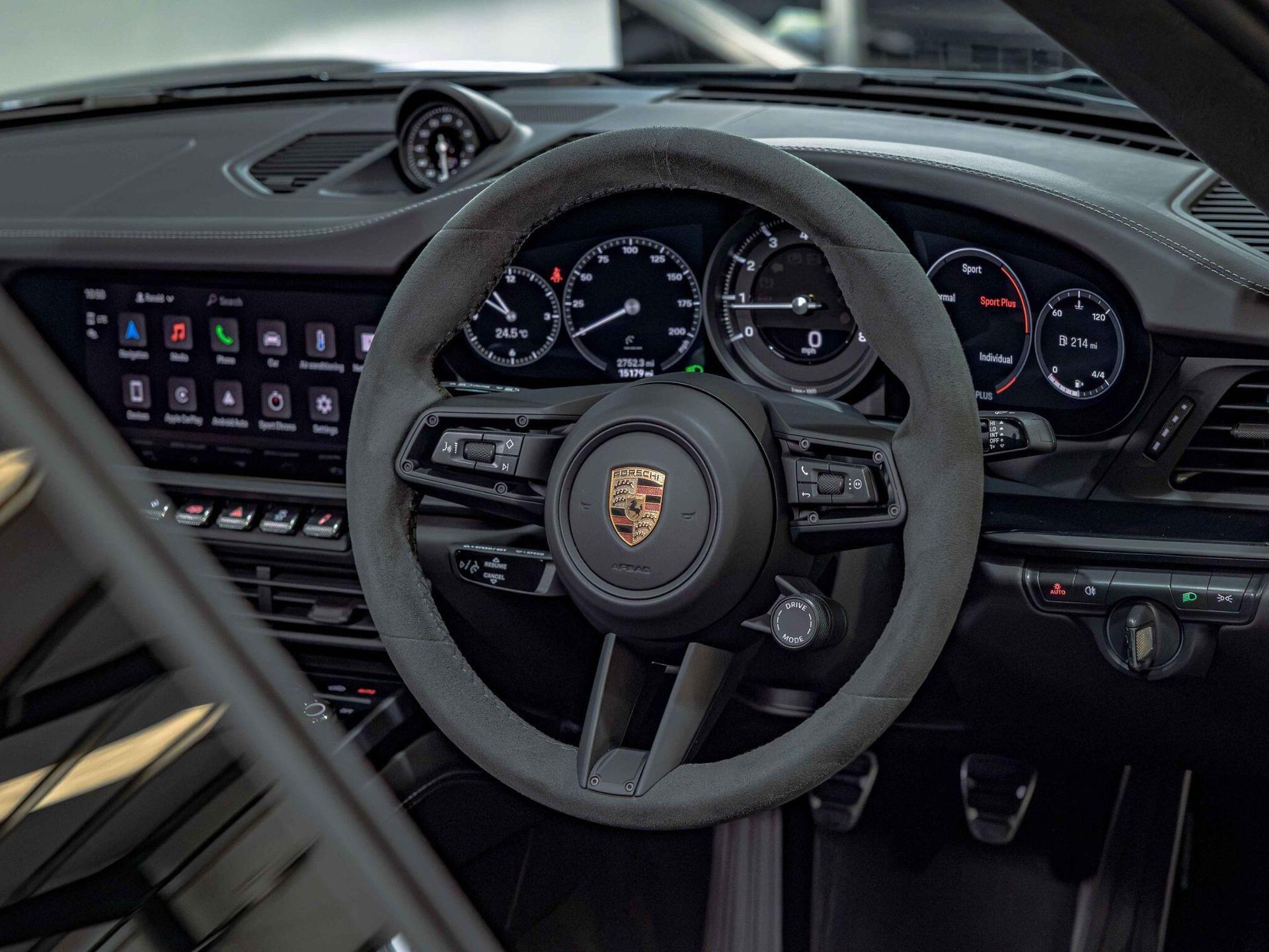 An interior shot of the steering wheel on a 2024 Porsche 911