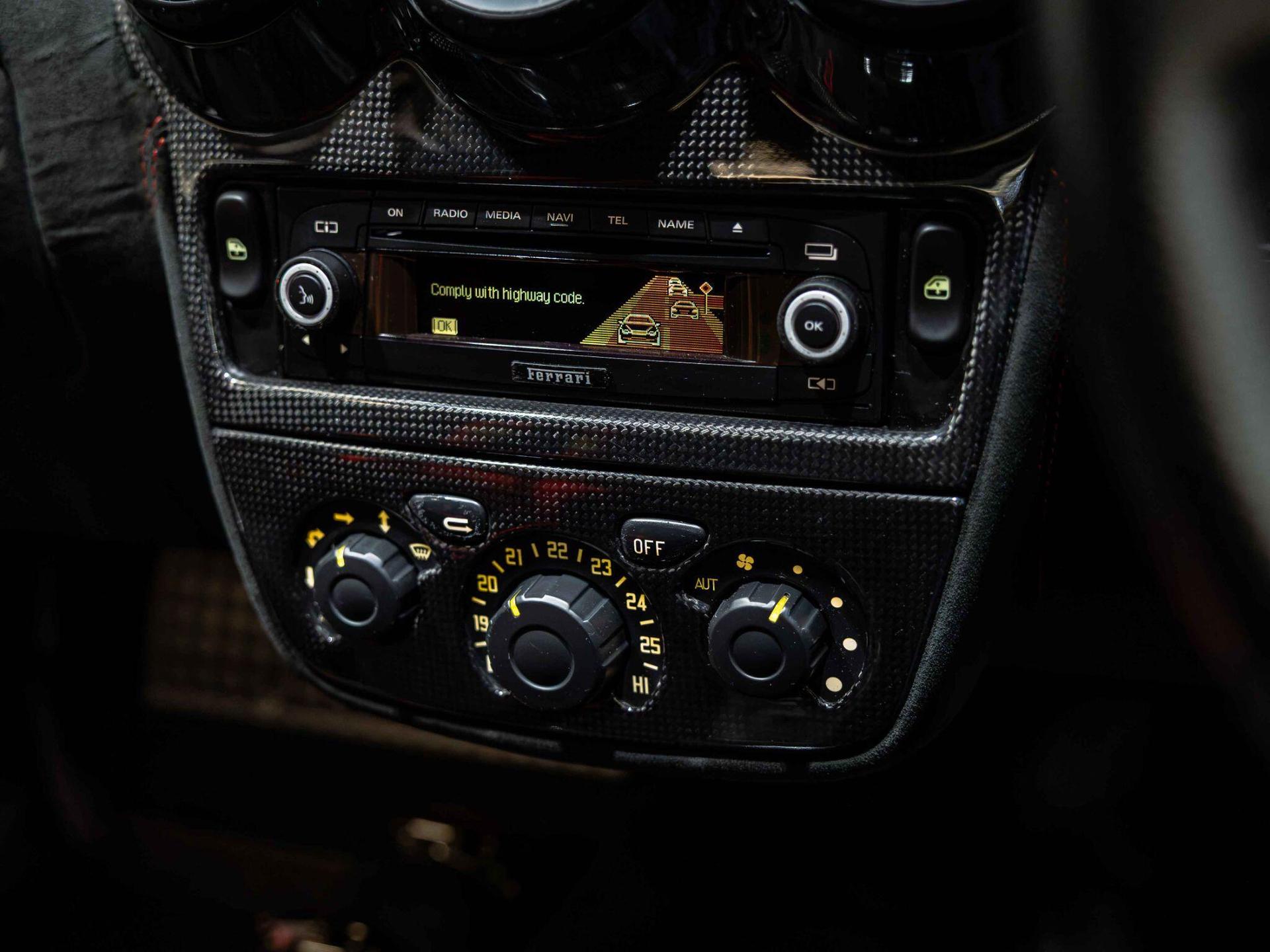 An interior shot of the infotainment system on a 2008 Ferrari 430