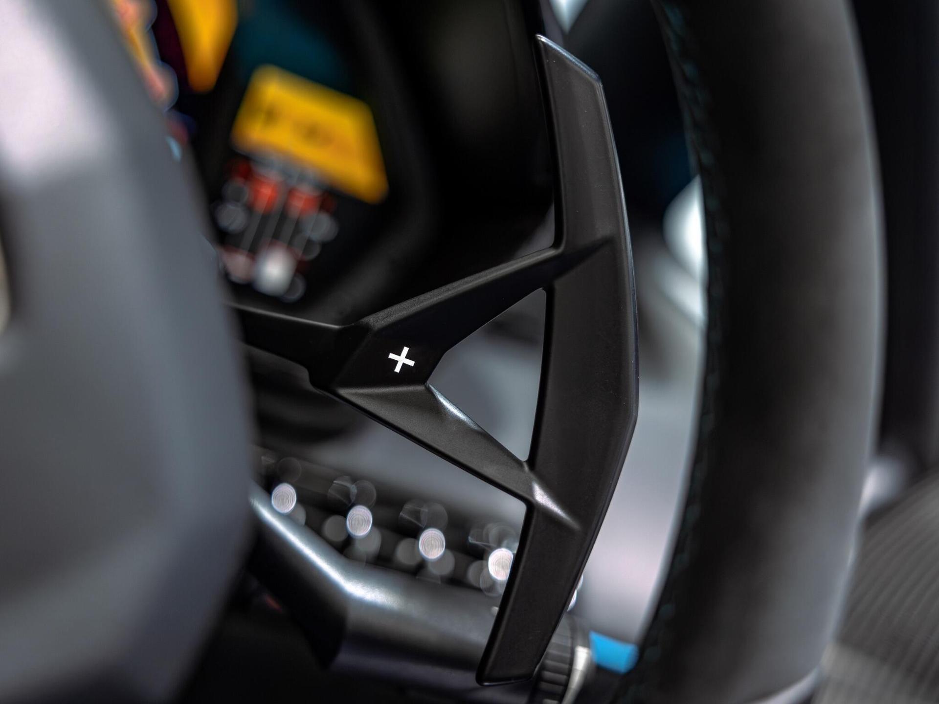 An interior shot of the steering wheel on a 2017 Lamborghini Aventador