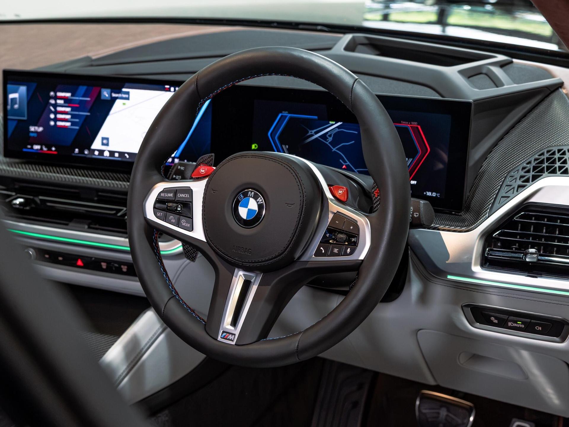 An interior shot of the steering wheel on a 2024 BMW XM