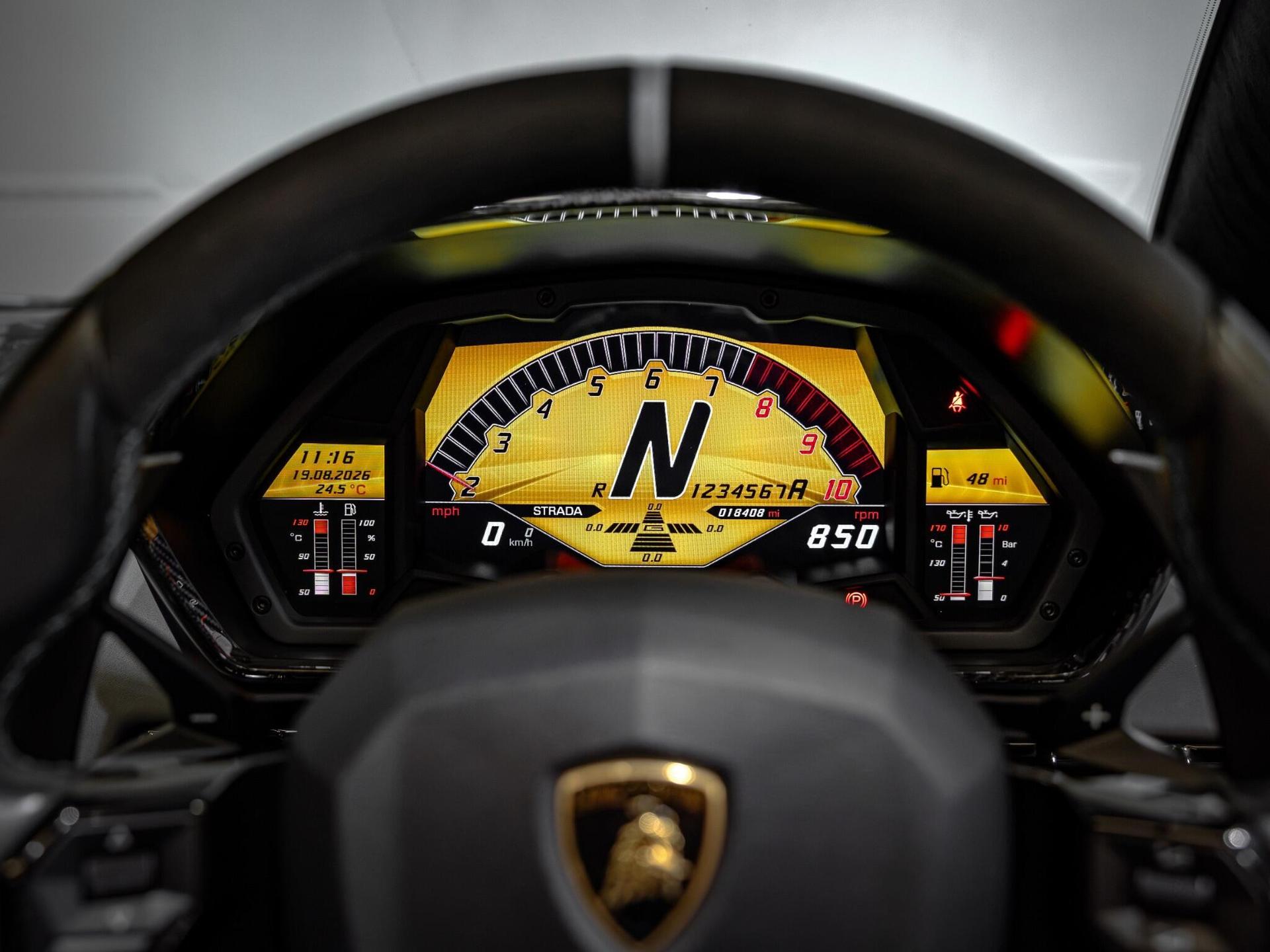 An interior shot of the steering wheel on a 2017 Lamborghini Aventador