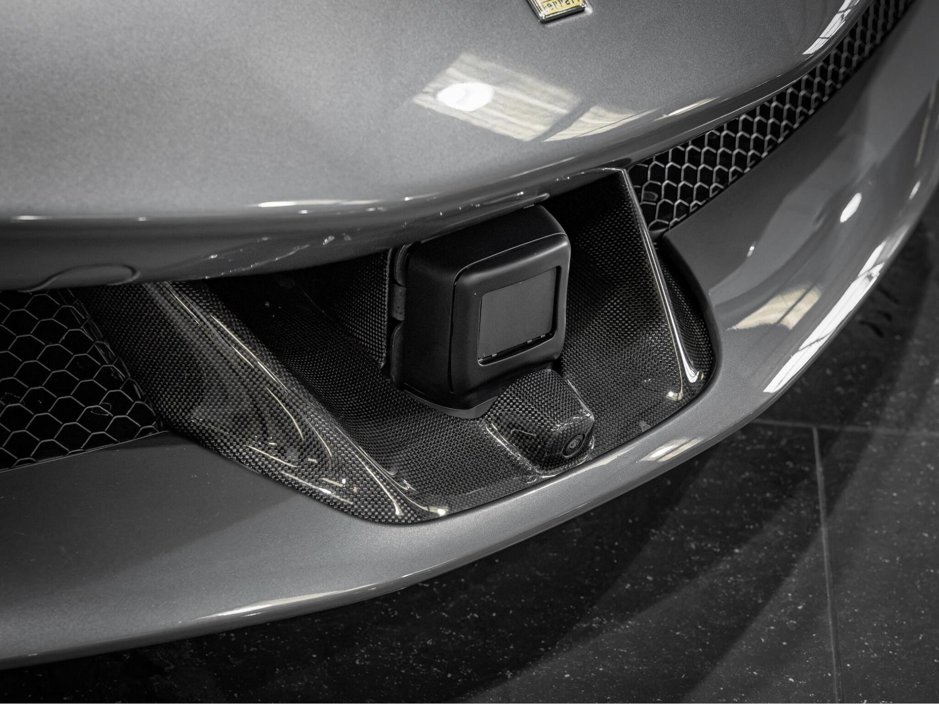 An exterior shot of the badge exterior on a 2023 Ferrari SF90 Spider