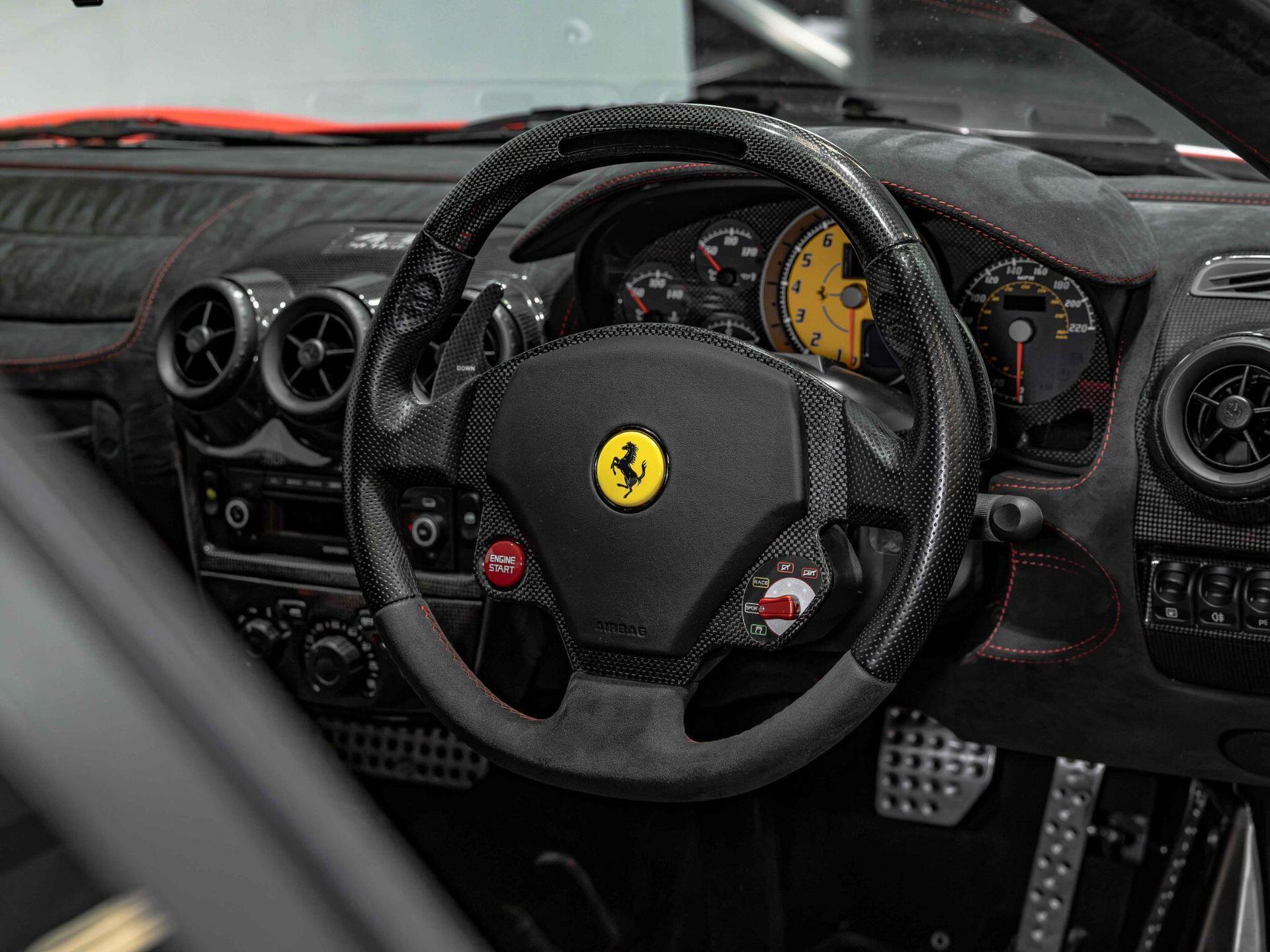 An interior shot of the steering wheel on a 2008 Ferrari 430