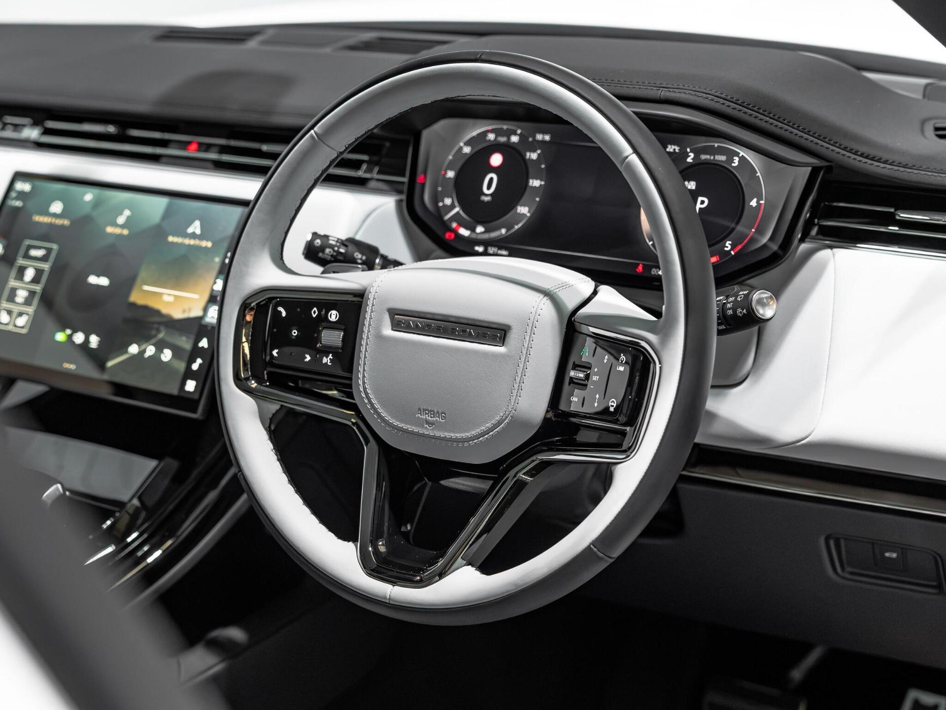 An interior shot of the steering wheel on a 2025 Land Rover Range Rover Sport