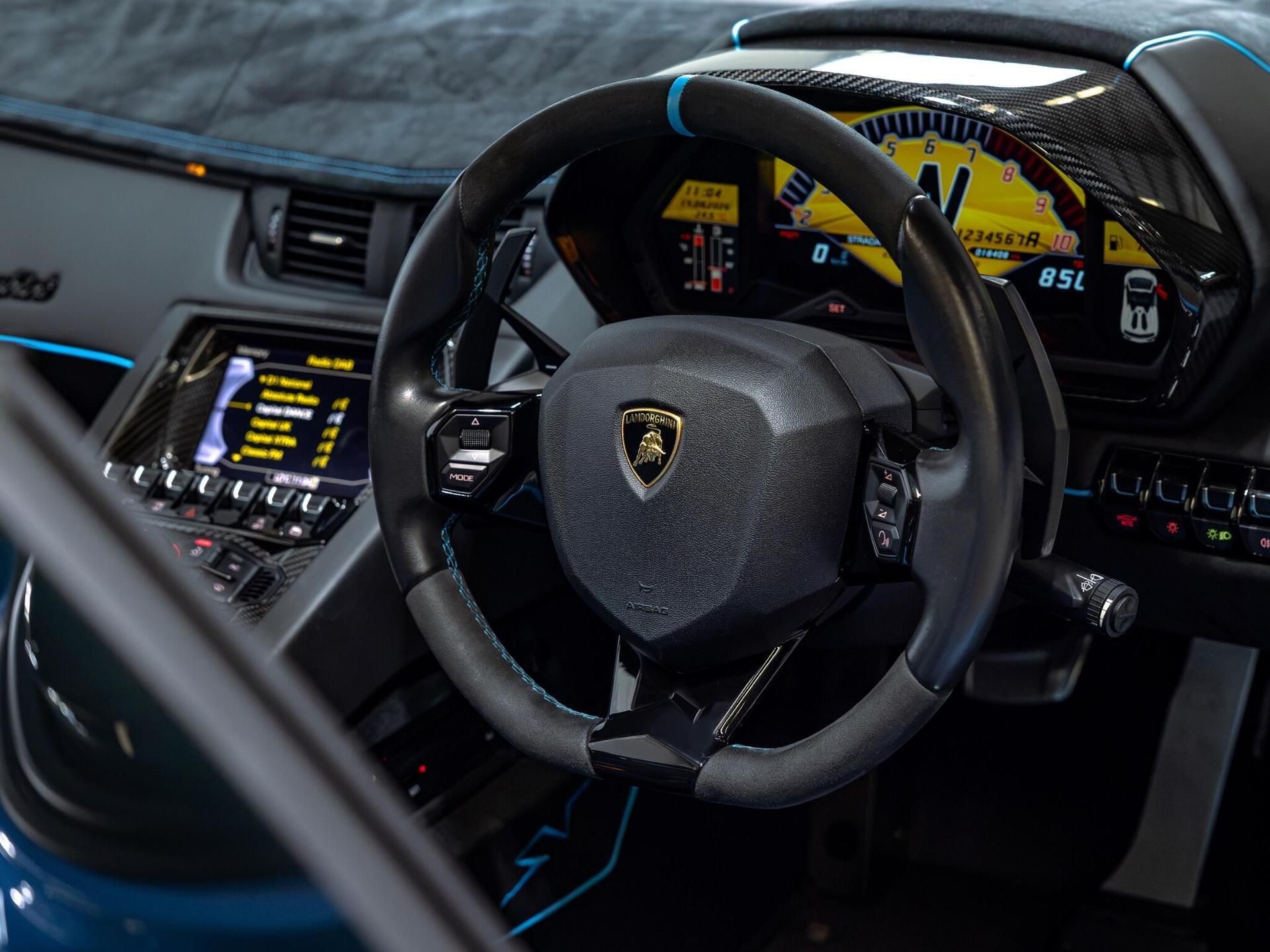 An interior shot of the steering wheel on a 2017 Lamborghini Aventador