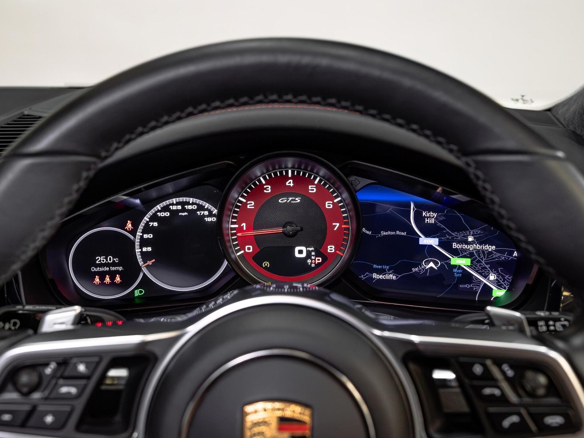 An interior shot of the driver instruments on a 2021 Porsche Cayenne