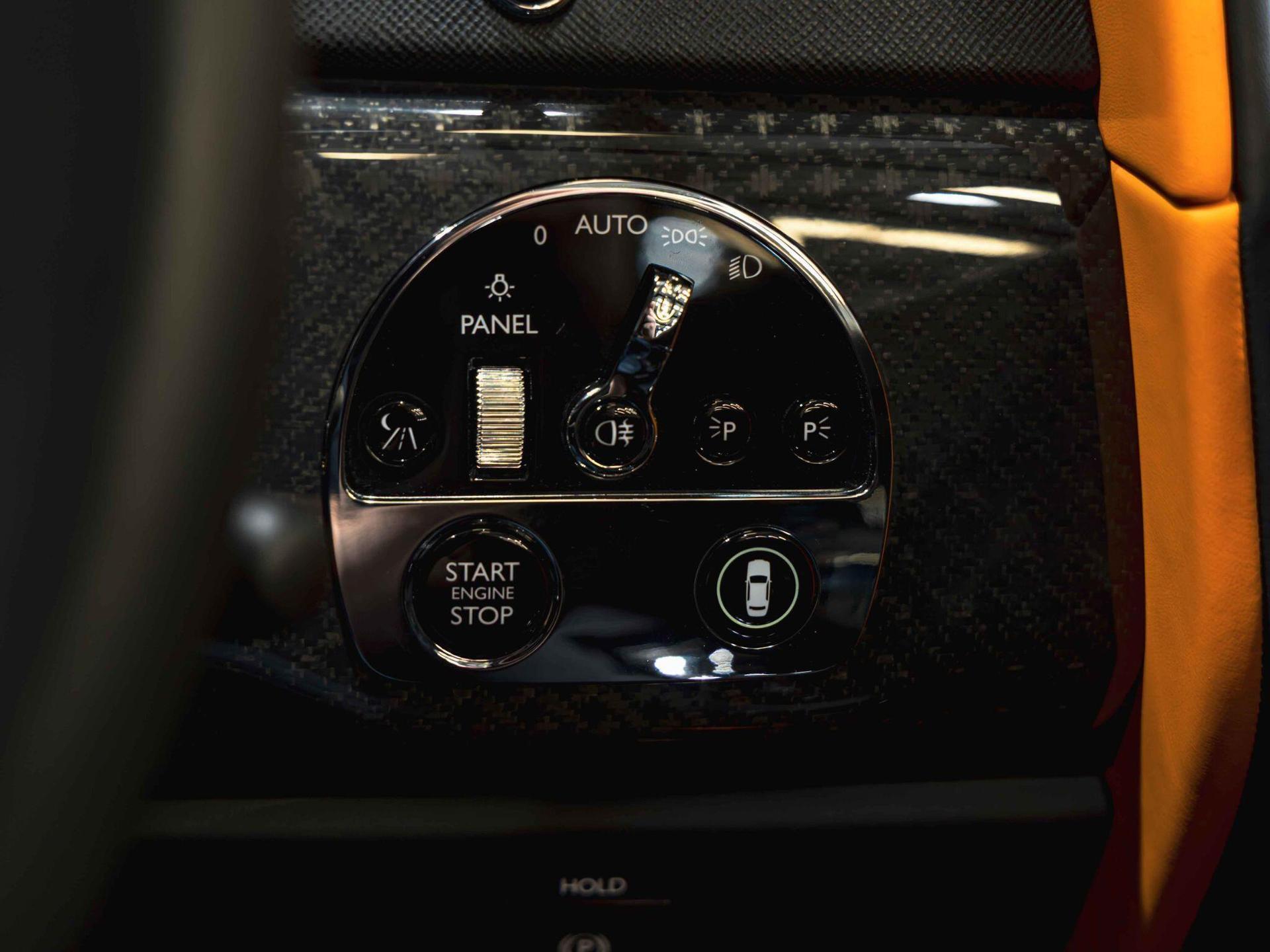 An interior shot of the misc controls on a 2023 Rolls-Royce Cullinan