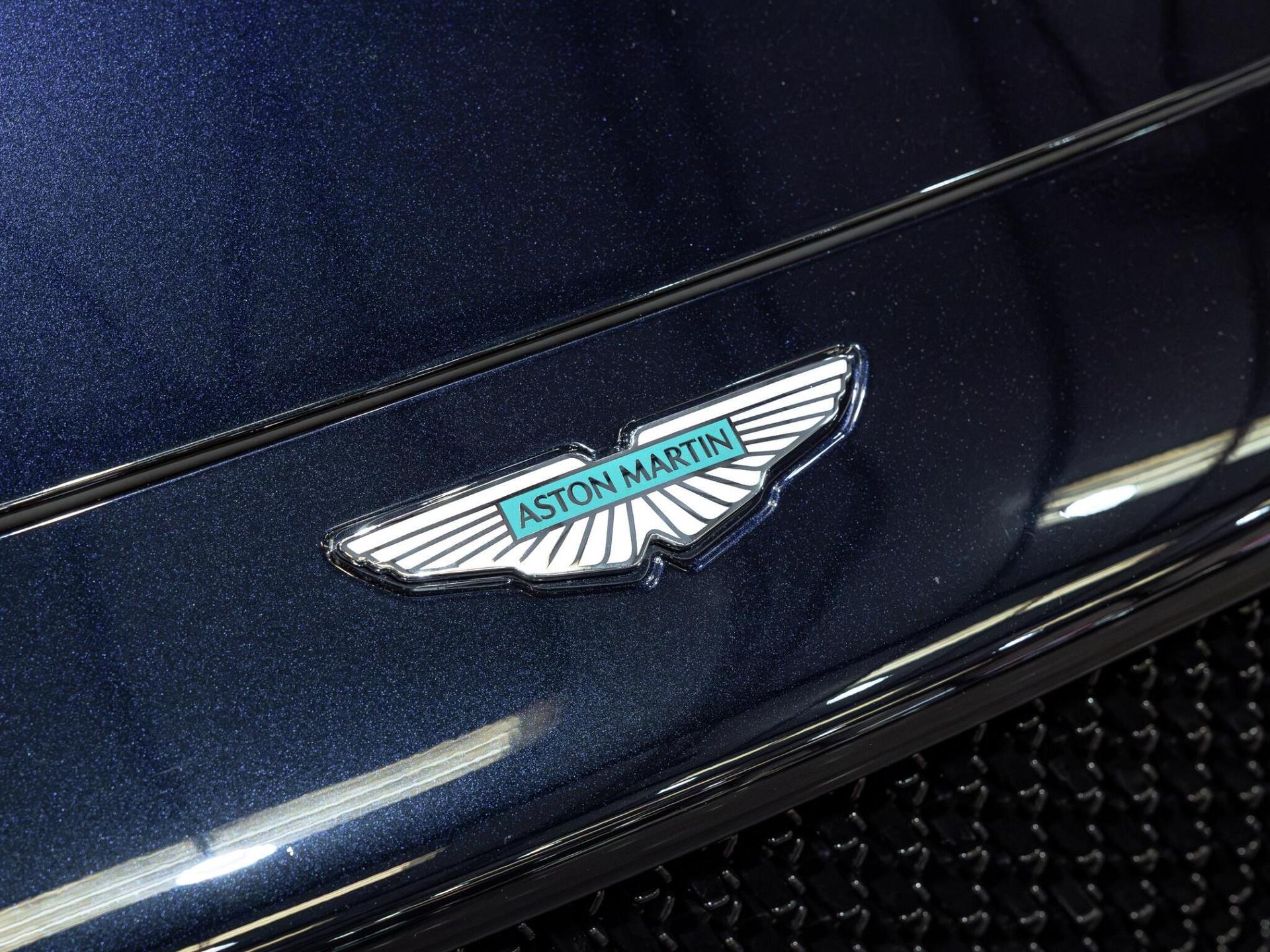 An exterior shot of the badge exterior on a 2025 Aston Martin DBX