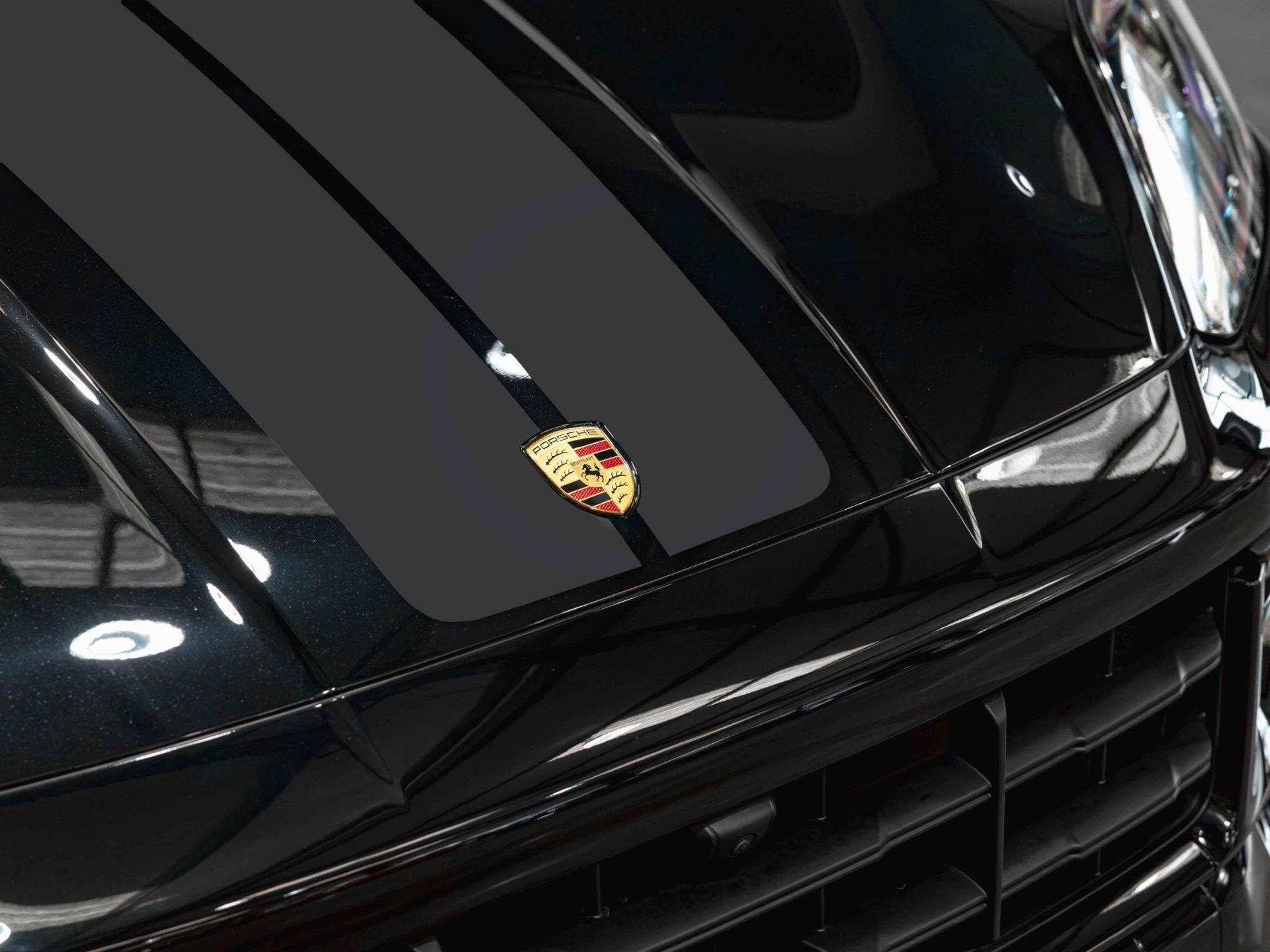 An exterior shot of the badge exterior on a 2025 Porsche Cayenne