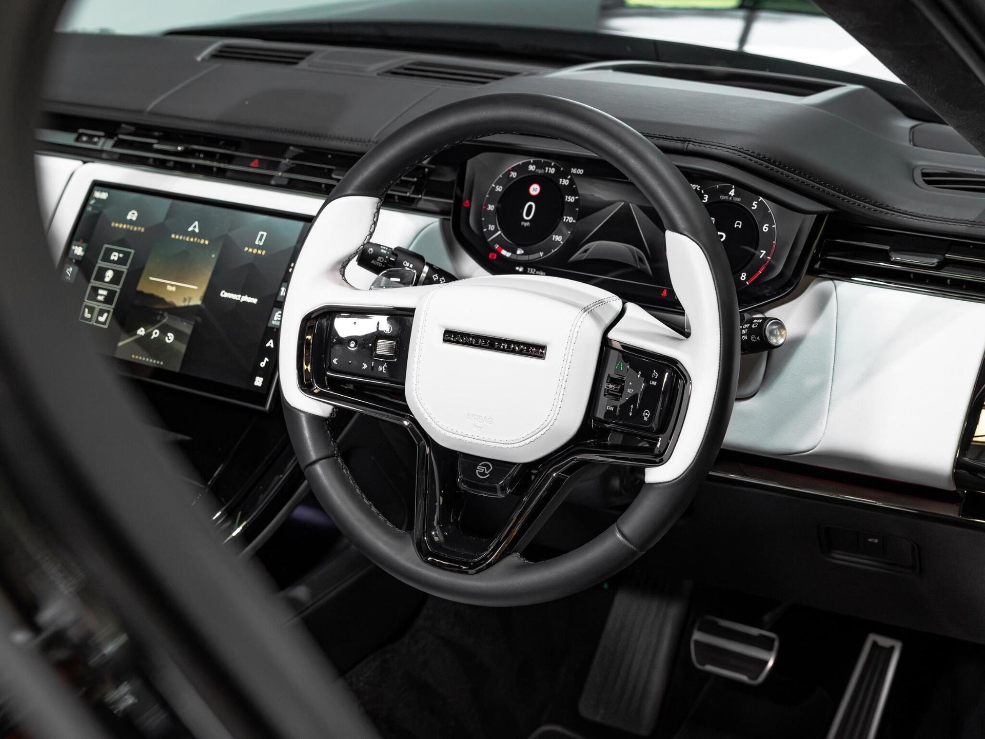 An interior shot of the steering wheel on a 2024 Land Rover Range Rover Sport