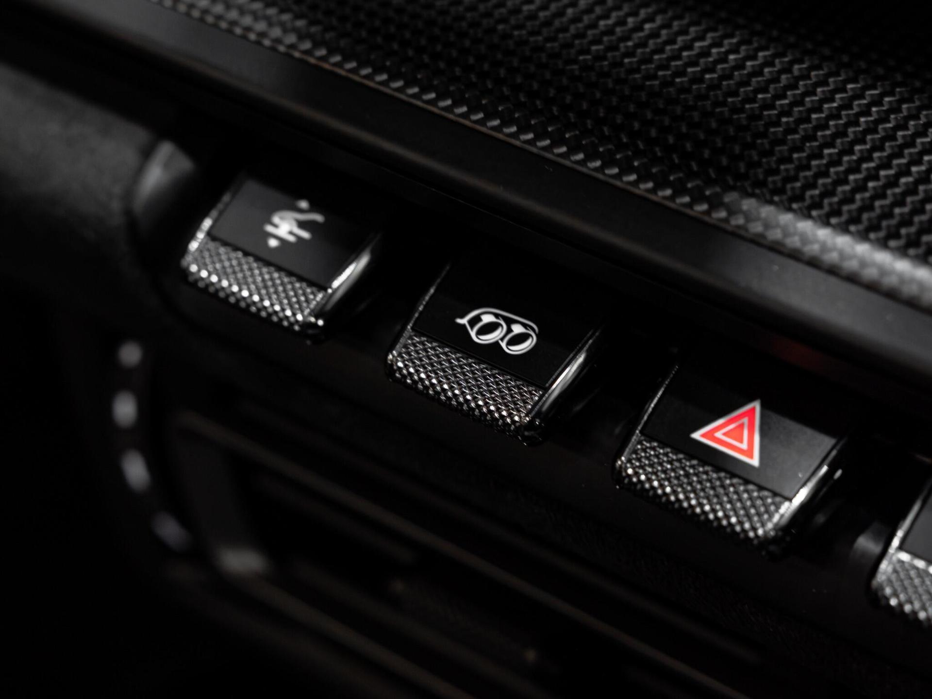 An interior shot of the misc controls on a 2021 Porsche 911