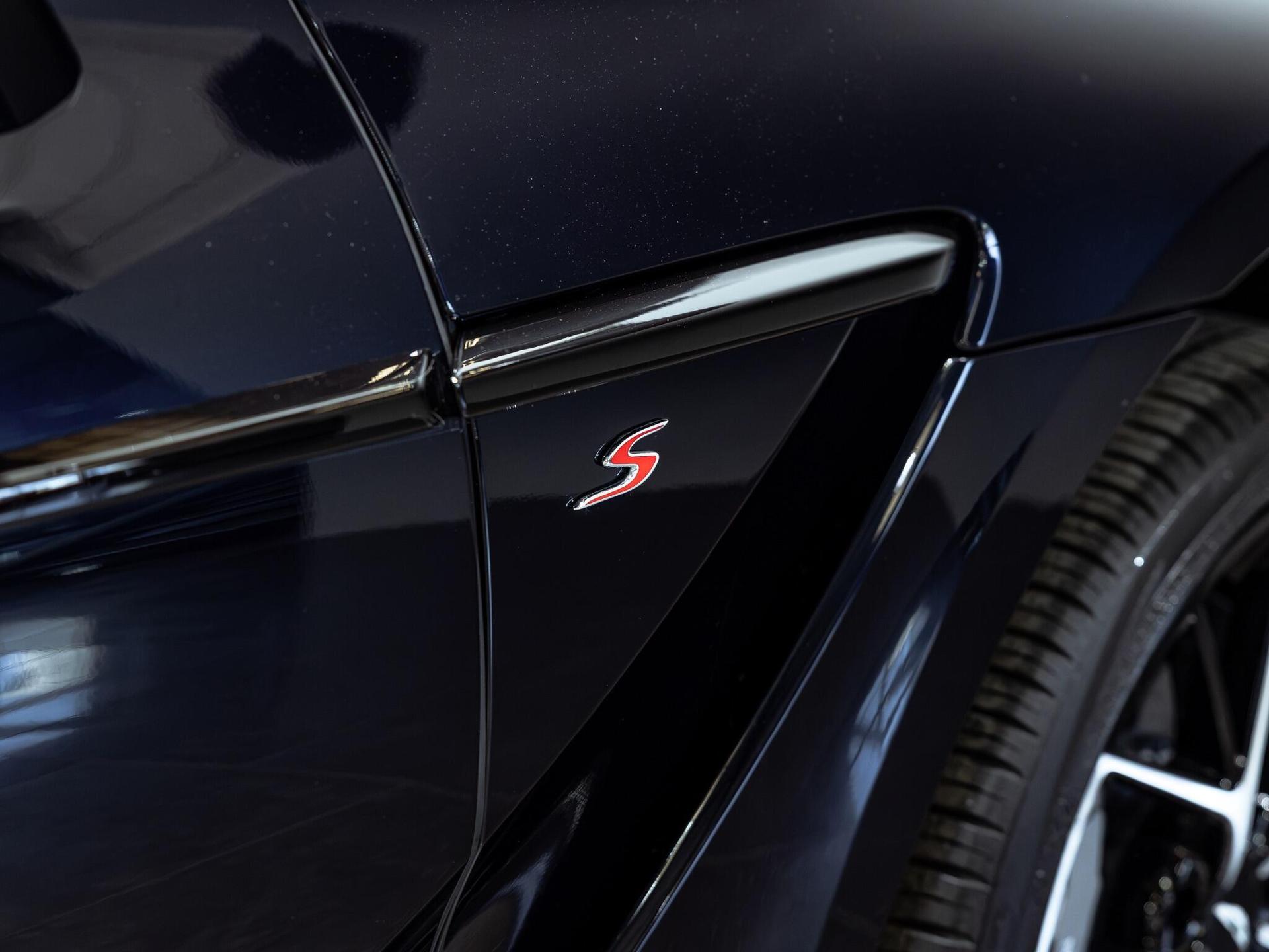 An exterior shot of the badge exterior on a 2025 Aston Martin DBX