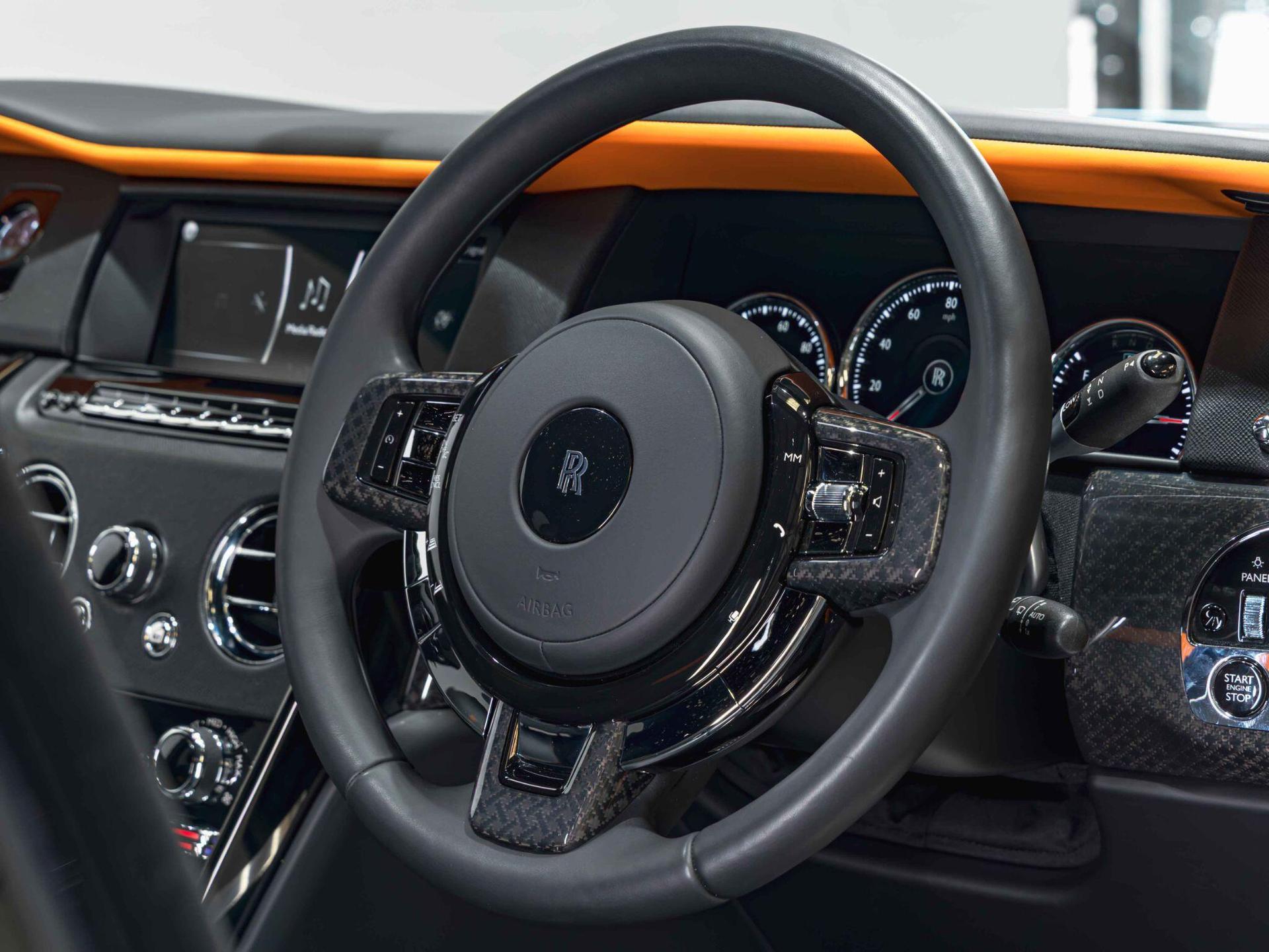 An interior shot of the steering wheel on a 2023 Rolls-Royce Cullinan