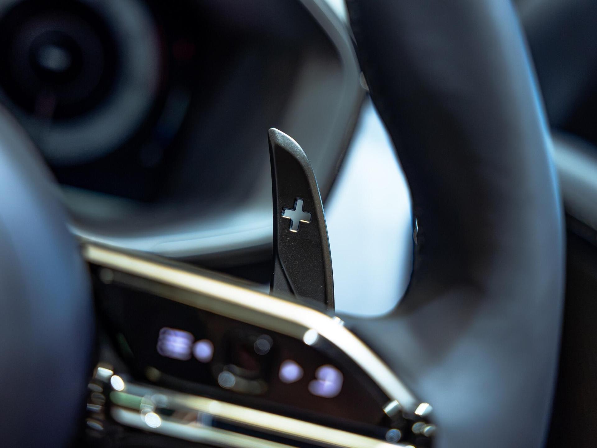 An interior shot of the steering wheel on a 2025 Aston Martin DBX