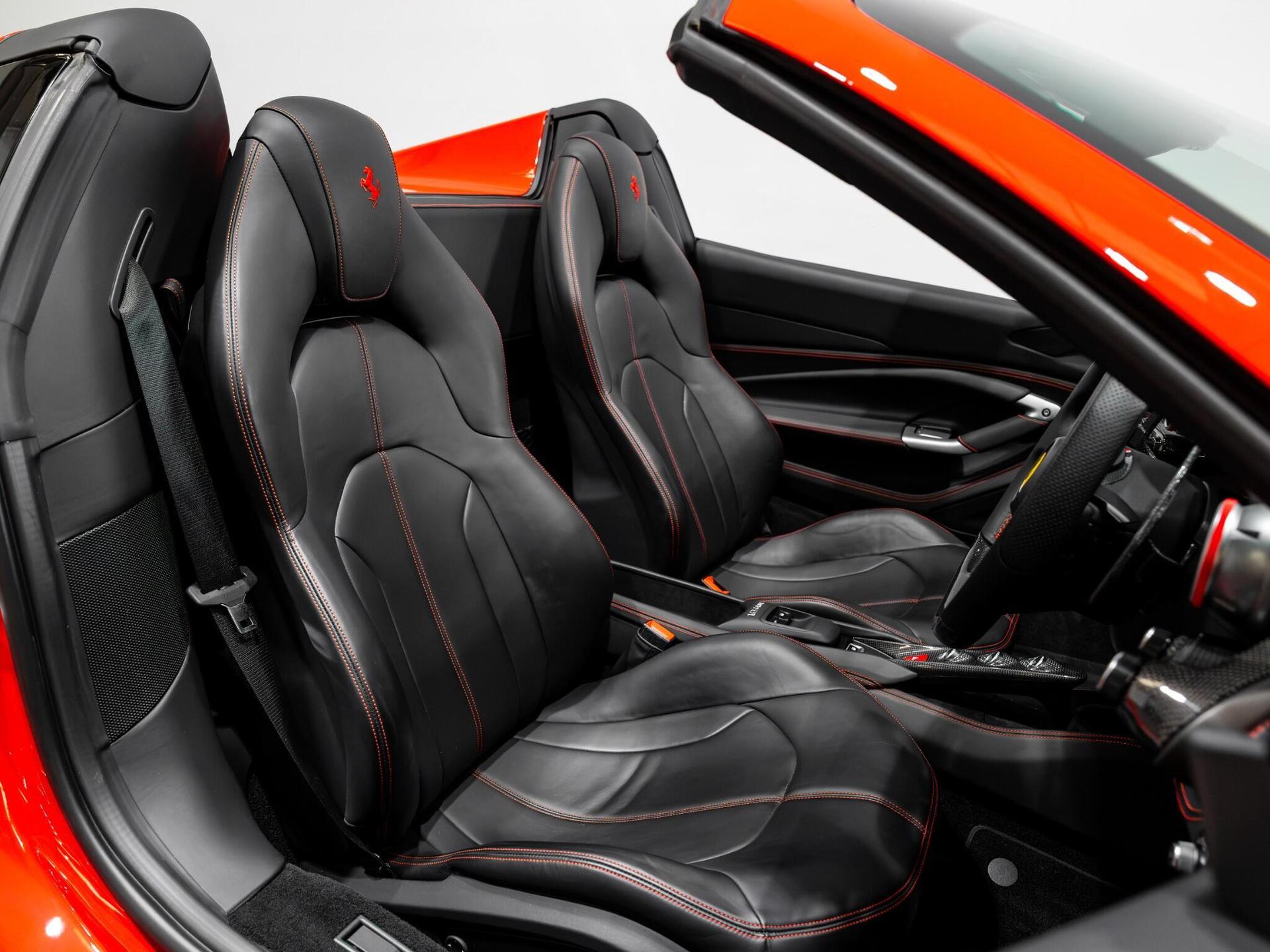 An interior shot of the driver seat on a 2022 Ferrari F8 Spider