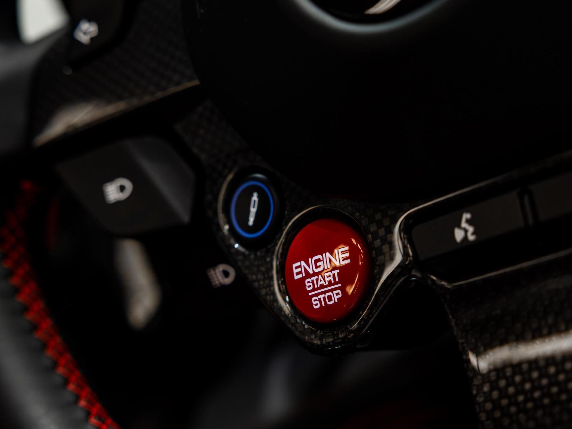An interior shot of the steering wheel on a 2022 Ferrari F8 Spider