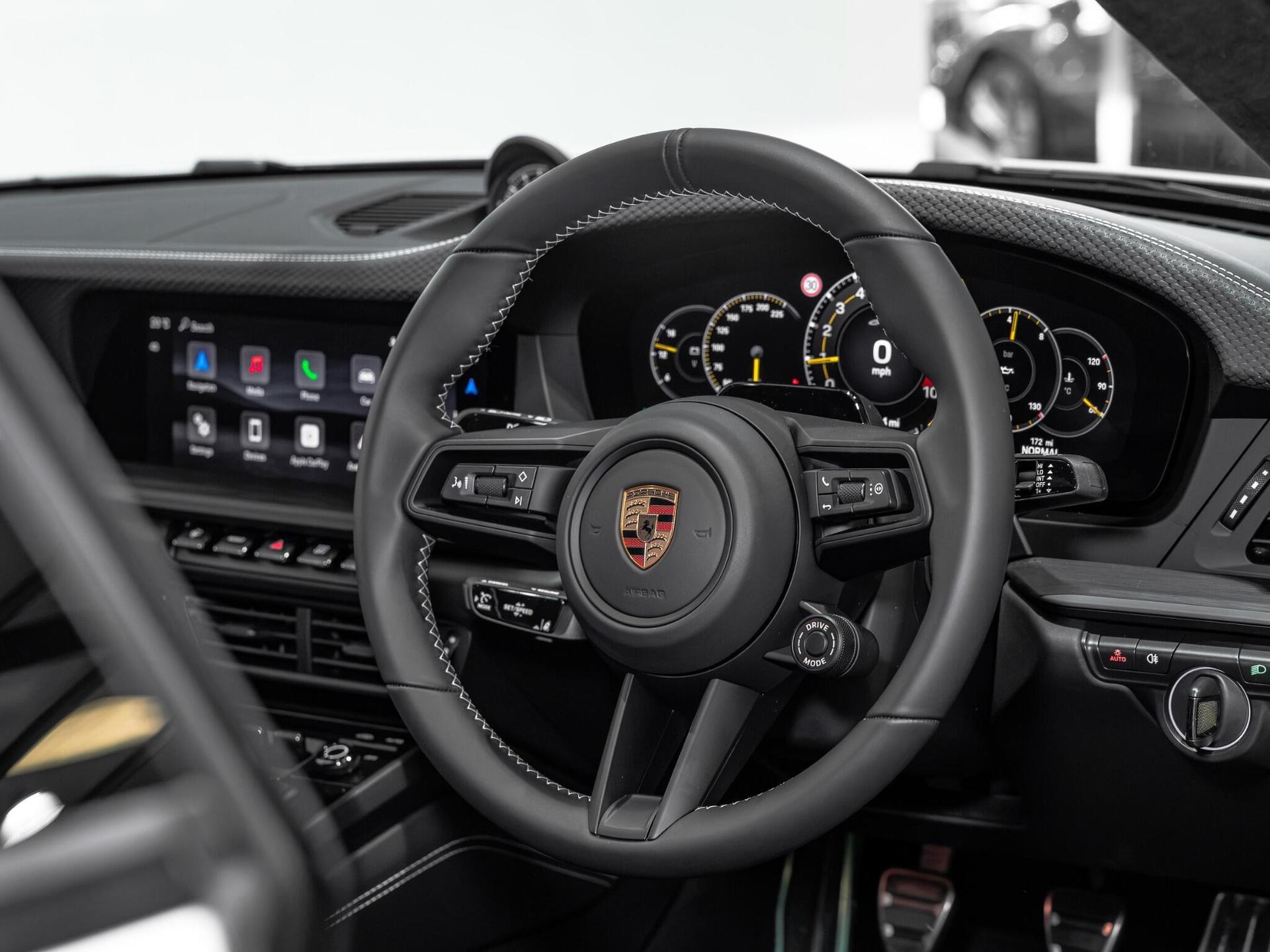 An interior shot of the steering wheel on a 2026 Porsche 911