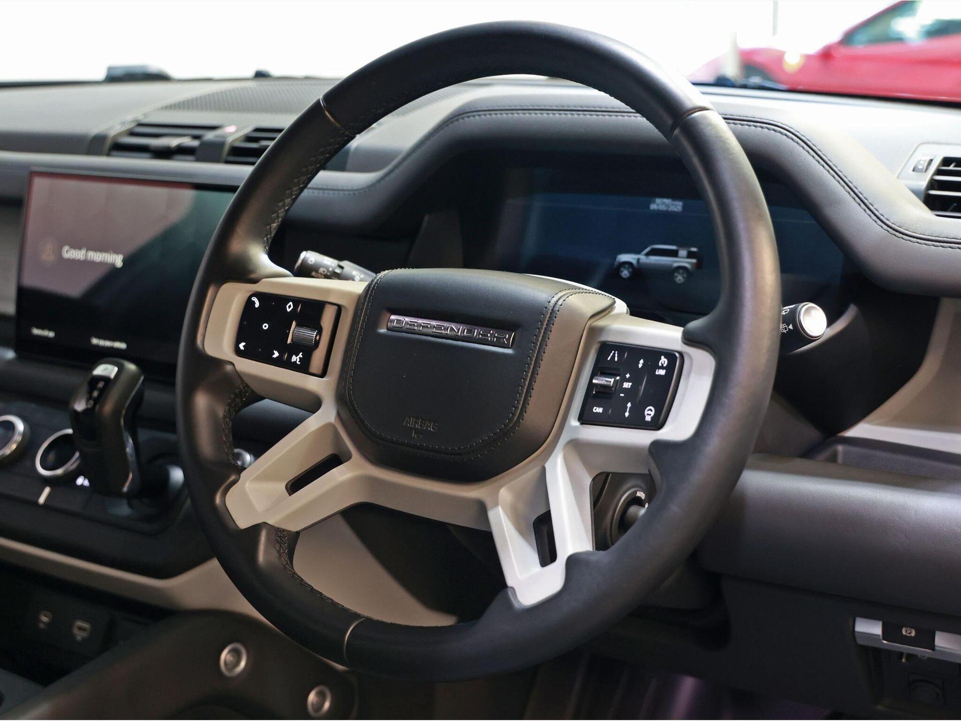 An interior shot of the steering wheel on a 2022 Land Rover Defender 110