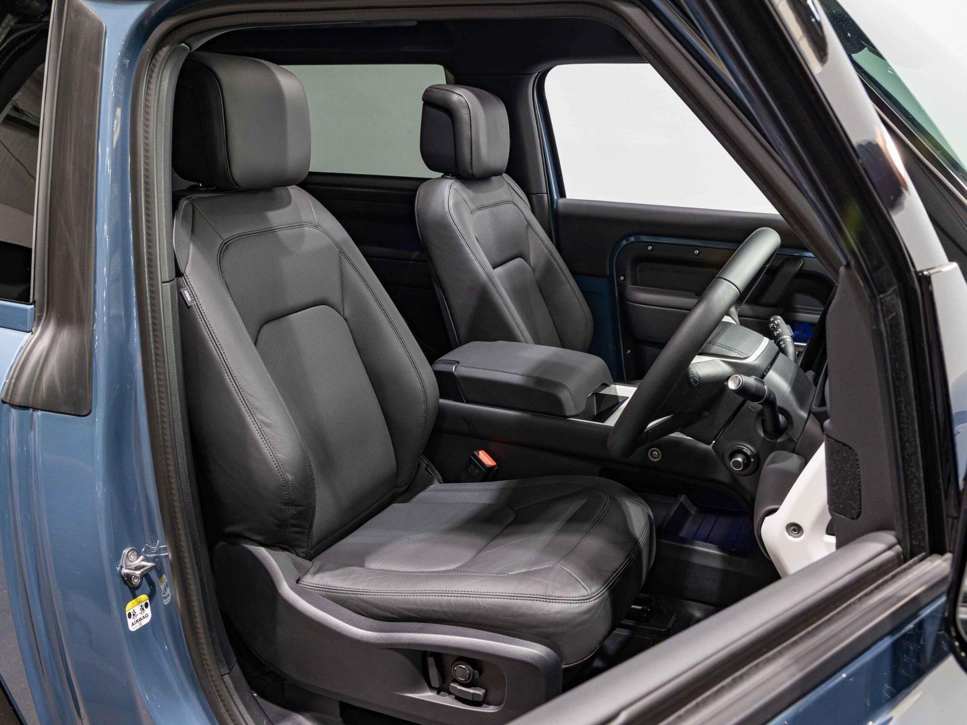 An interior shot of the driver seat on a 2025 Land Rover Defender 90