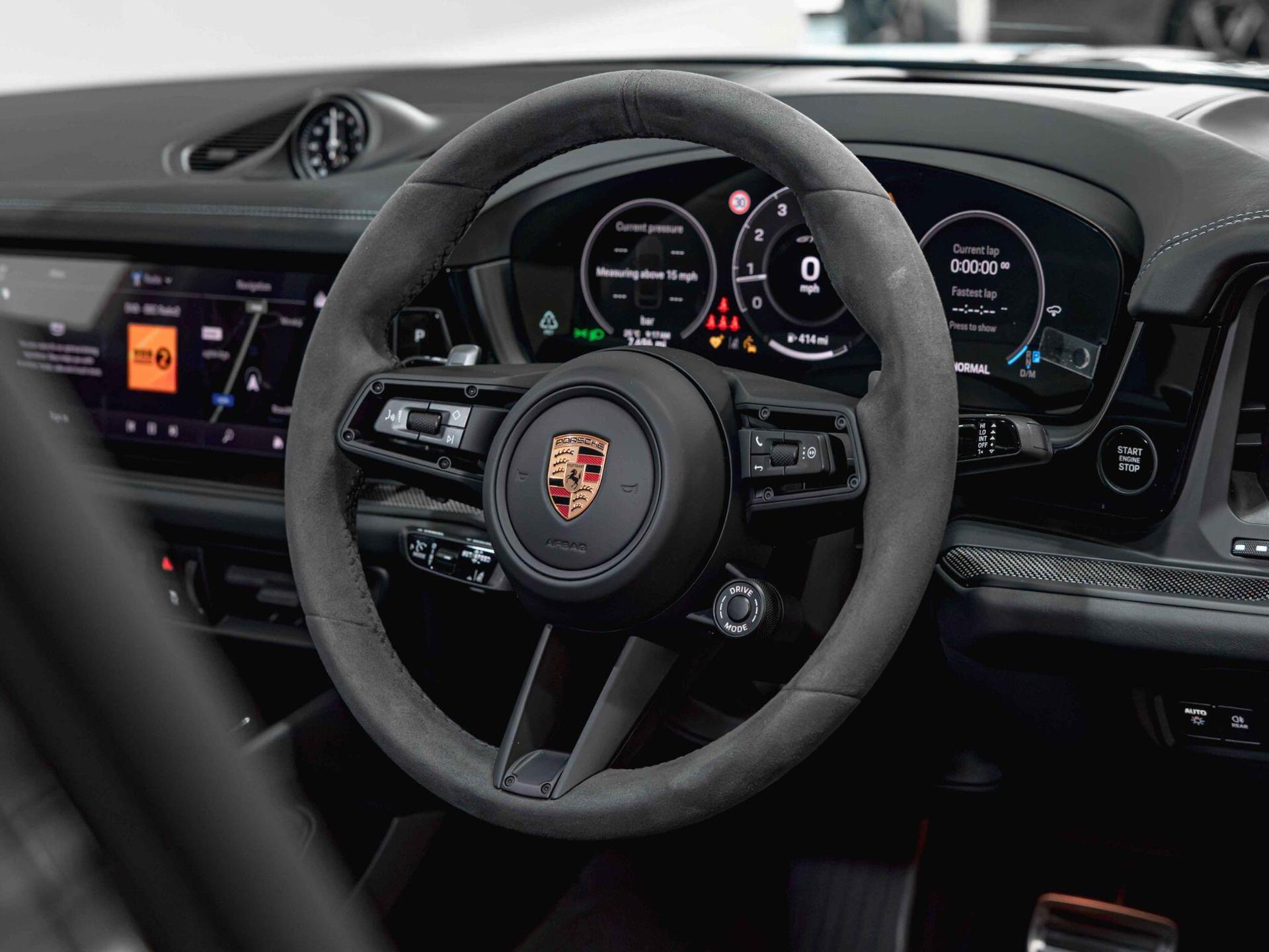 An interior shot of the steering wheel on a 2025 Porsche Cayenne