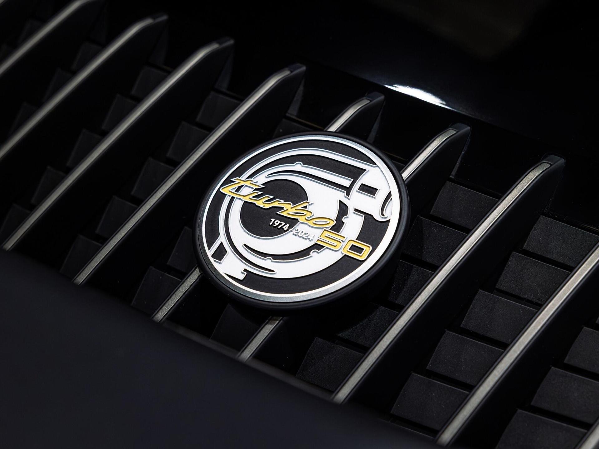 An exterior shot of the badge exterior on a 2024 Porsche 911
