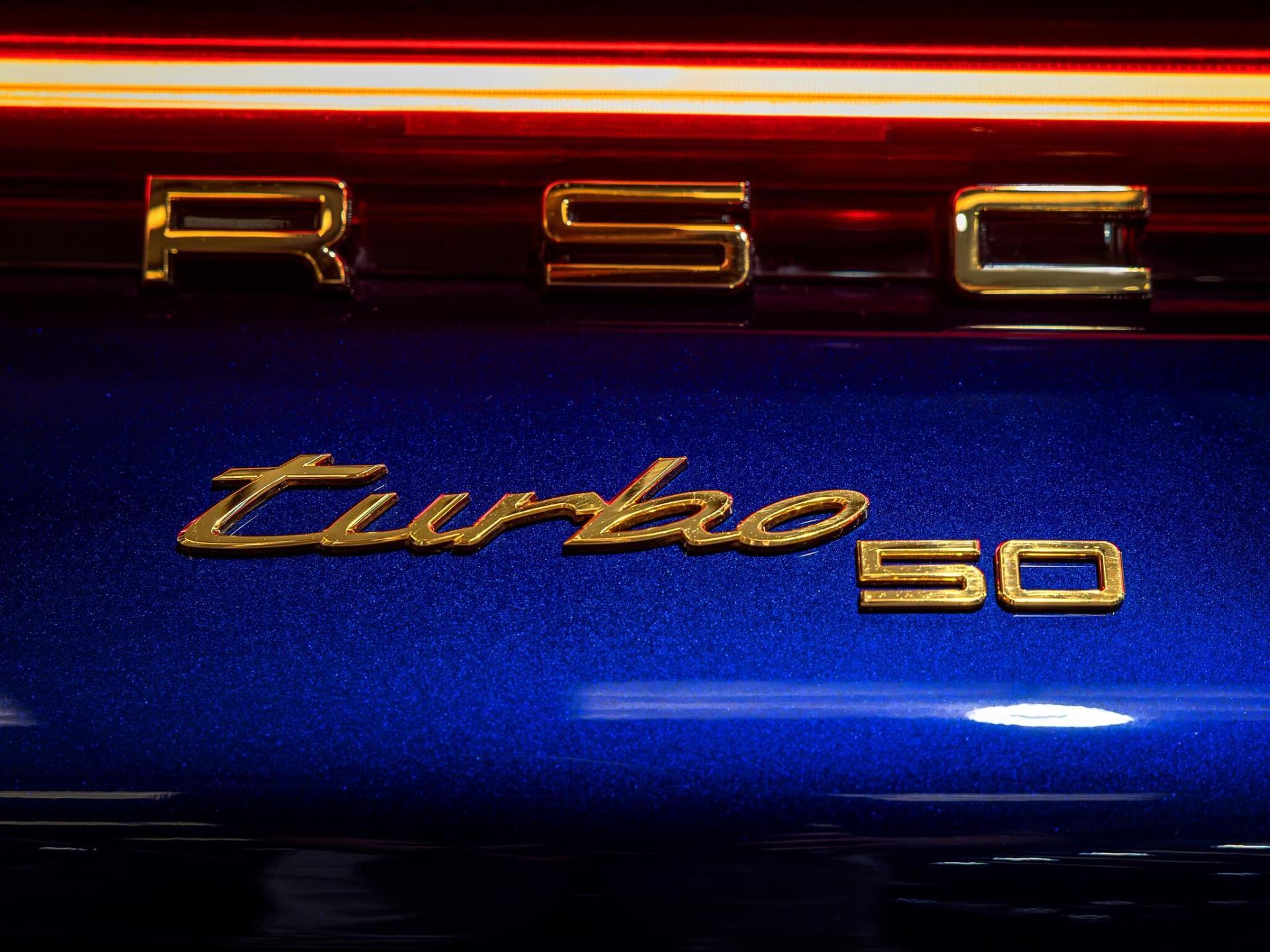 An exterior shot of the badge exterior on a 2024 Porsche 911