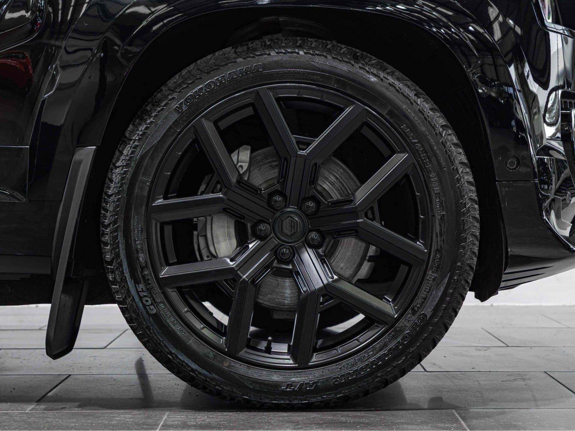 An exterior shot of the wheel on a 2025 Land Rover Defender 90