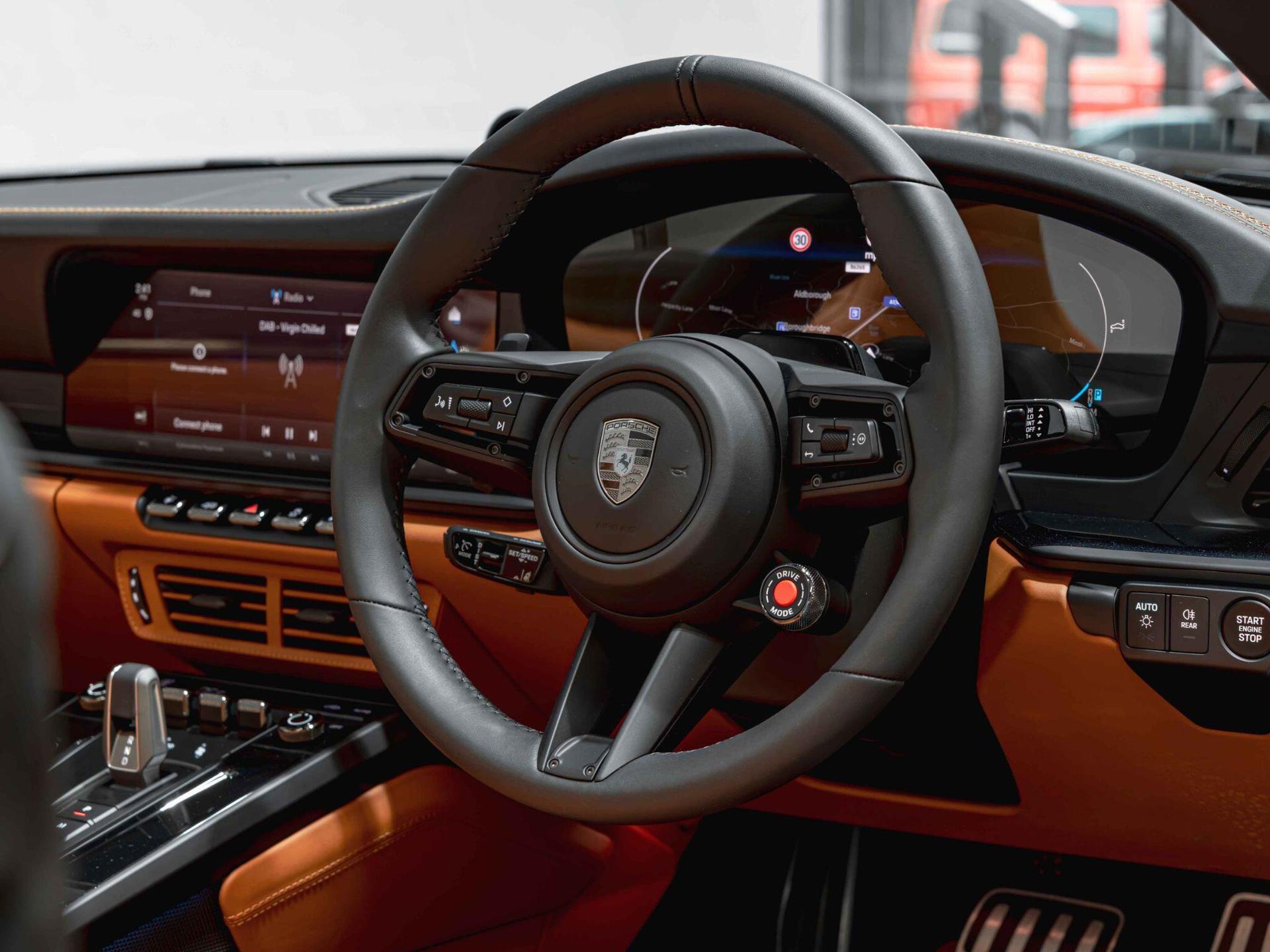 An interior shot of the steering wheel on a 2026 Porsche 911