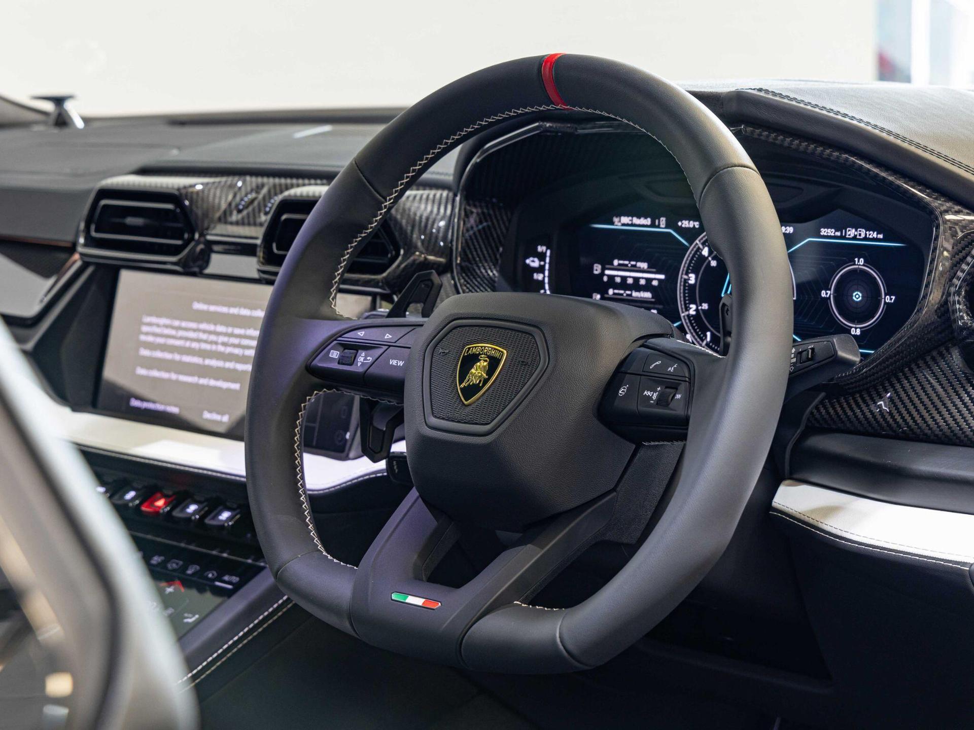 An interior shot of the steering wheel on a 2025 Lamborghini Urus