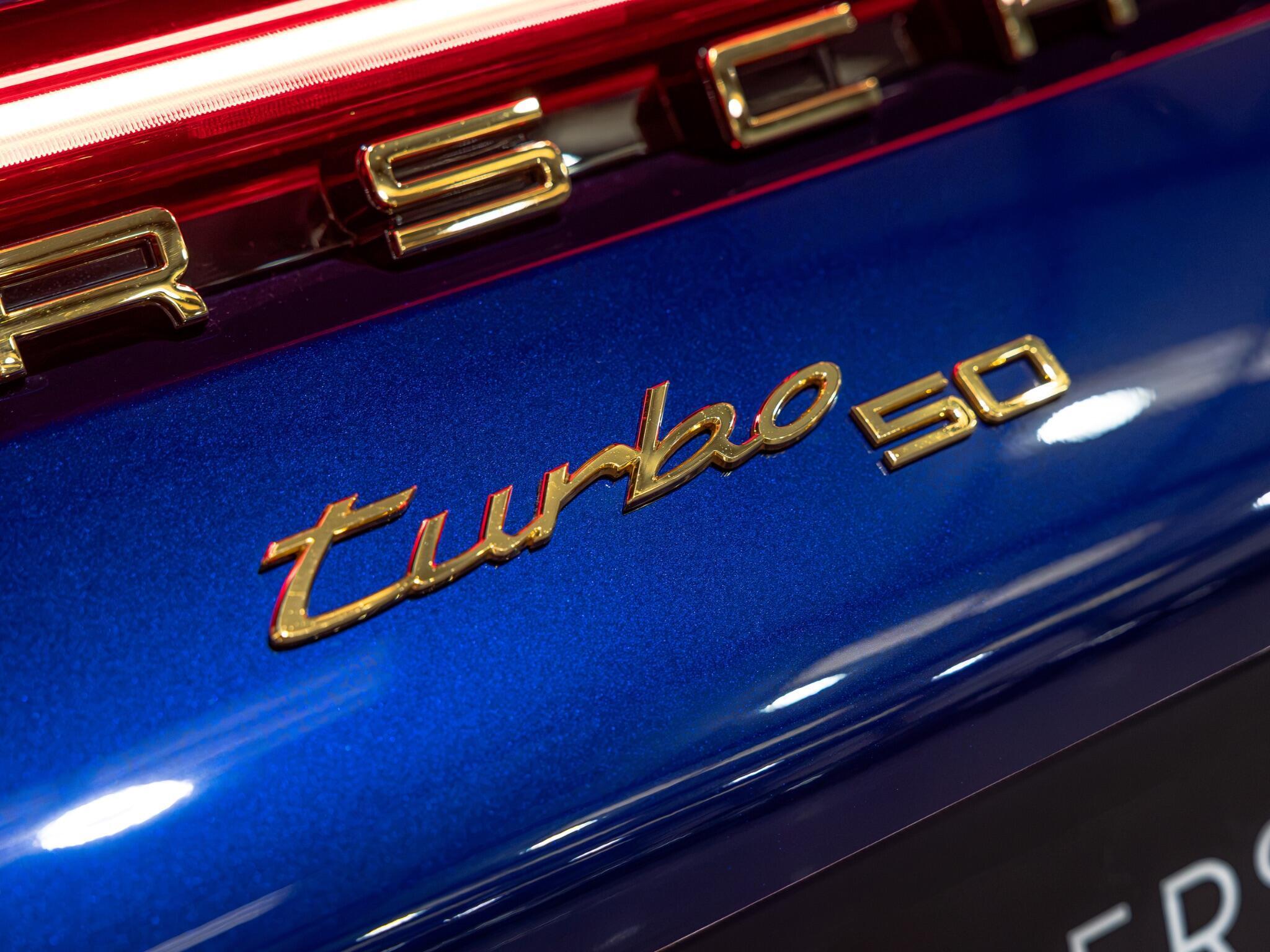 An exterior shot of the badge exterior on a 2024 Porsche 911